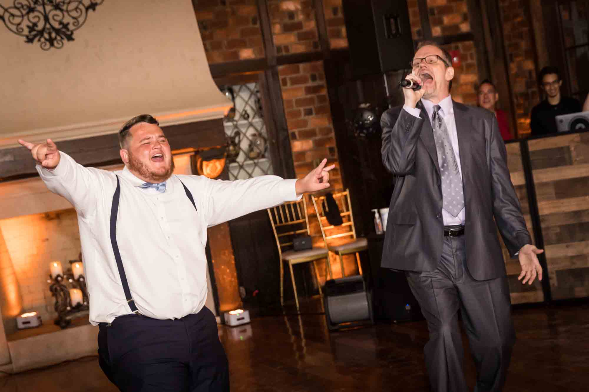 Male guest dancing in front of singer at Riviera Waterfront Mansion wedding