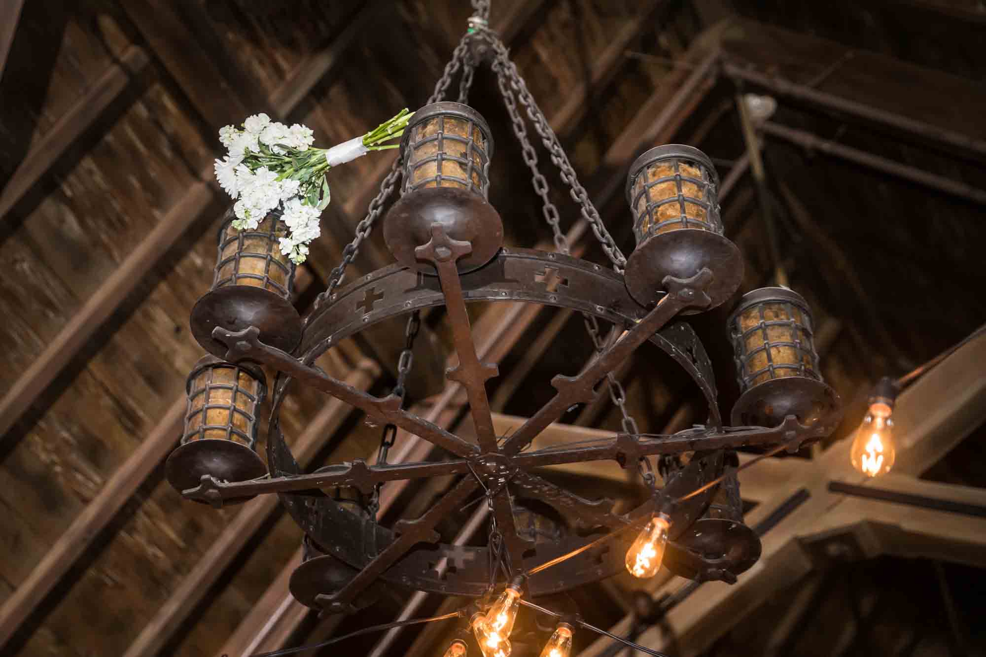 White bouquet caught on chandelier