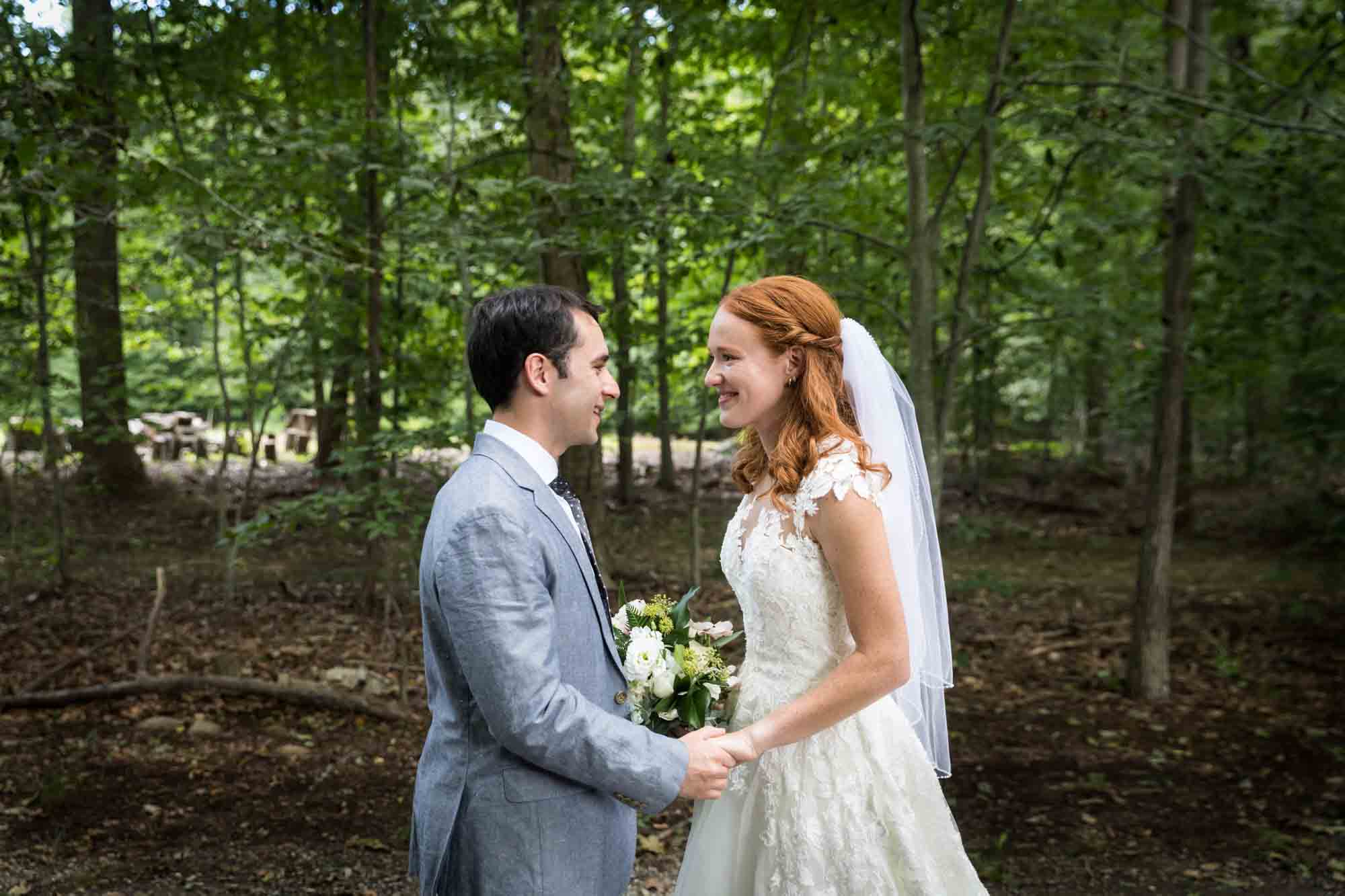 Bride and groom holding hands after first look