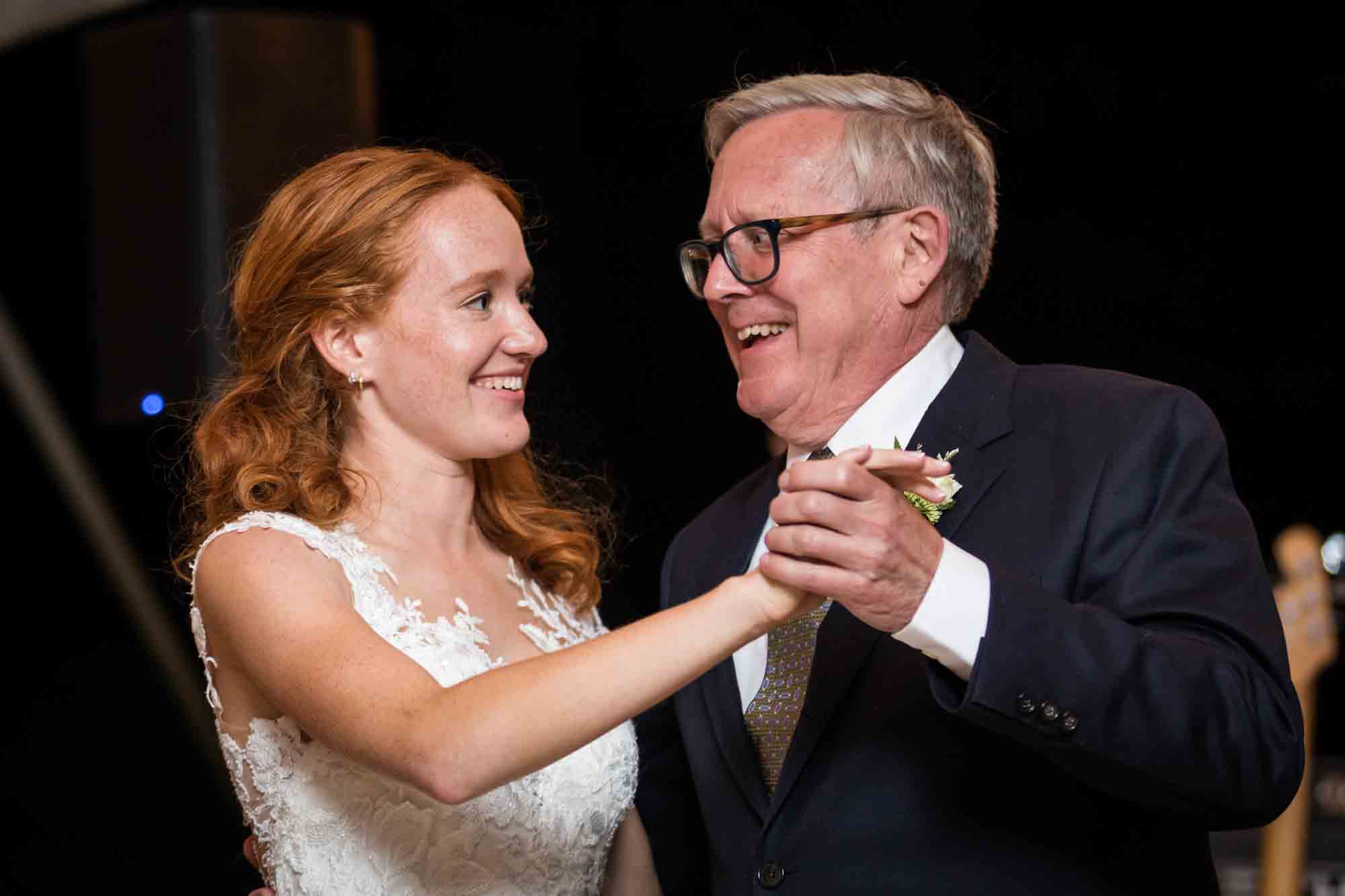 Bride dancing with father for an article on backyard wedding tips