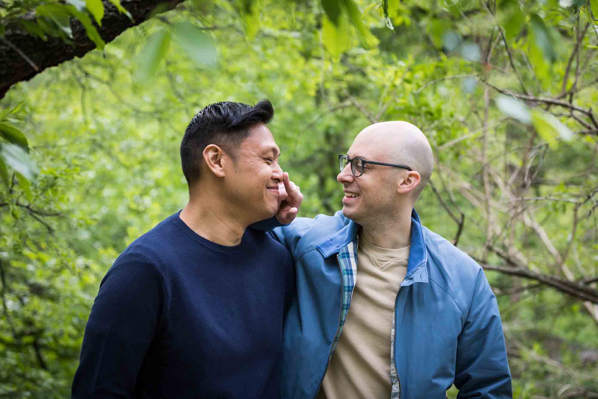 Man touching other man's nose from a Central Park engagement photo shoot