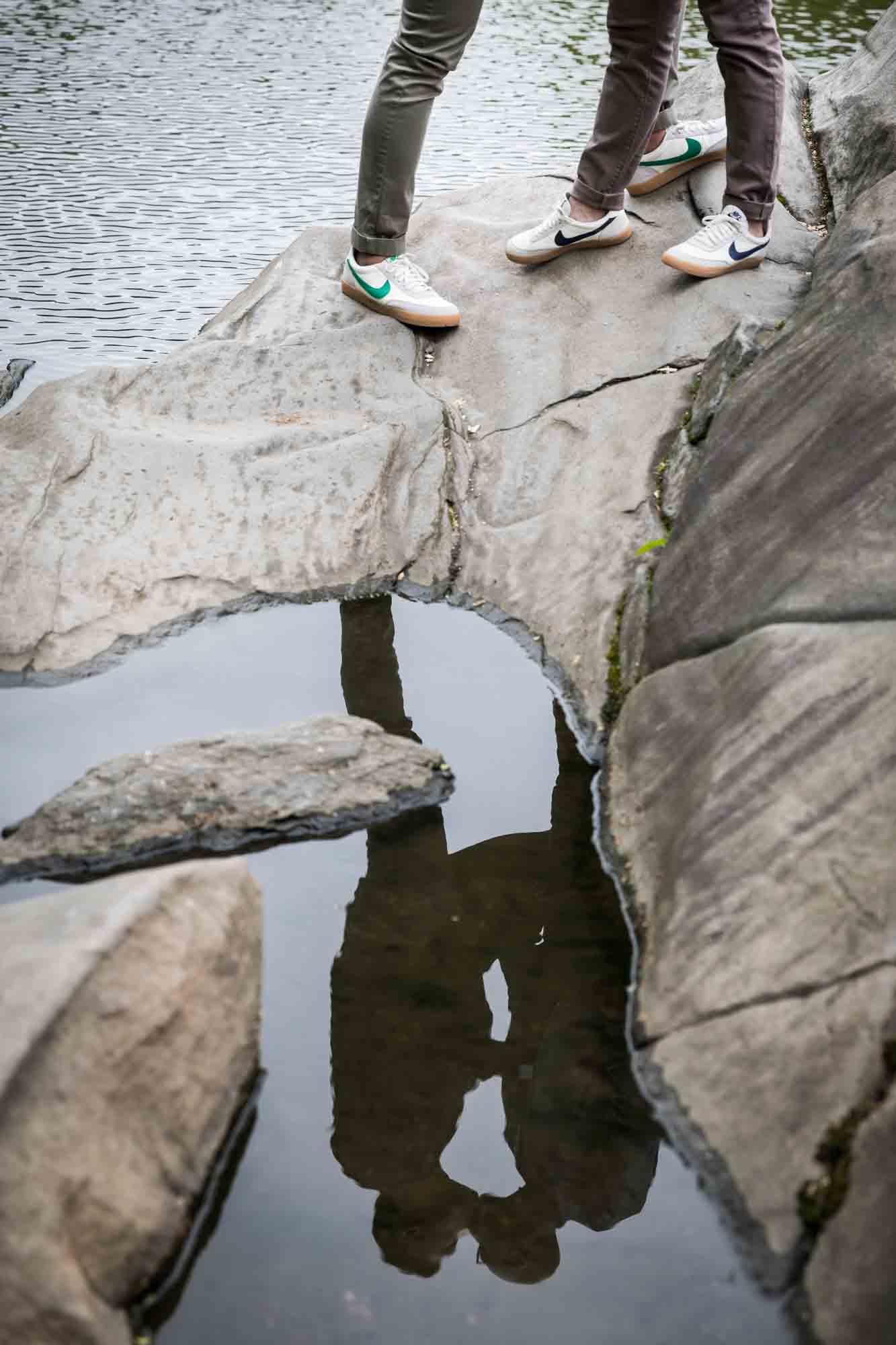 Reflection of two men in water