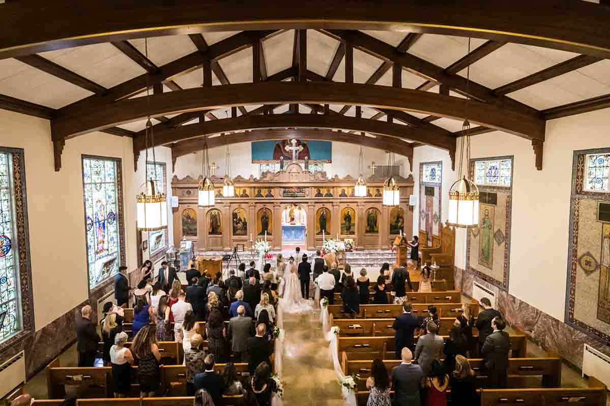 View from choir loft of eastern orthodox wedding ceremony