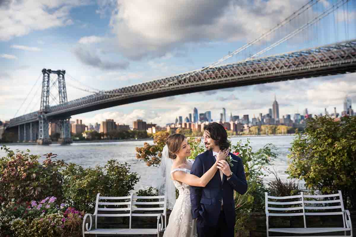 Giando on the Water wedding photos of bride and groom with Williamsburg Bridge in the background 