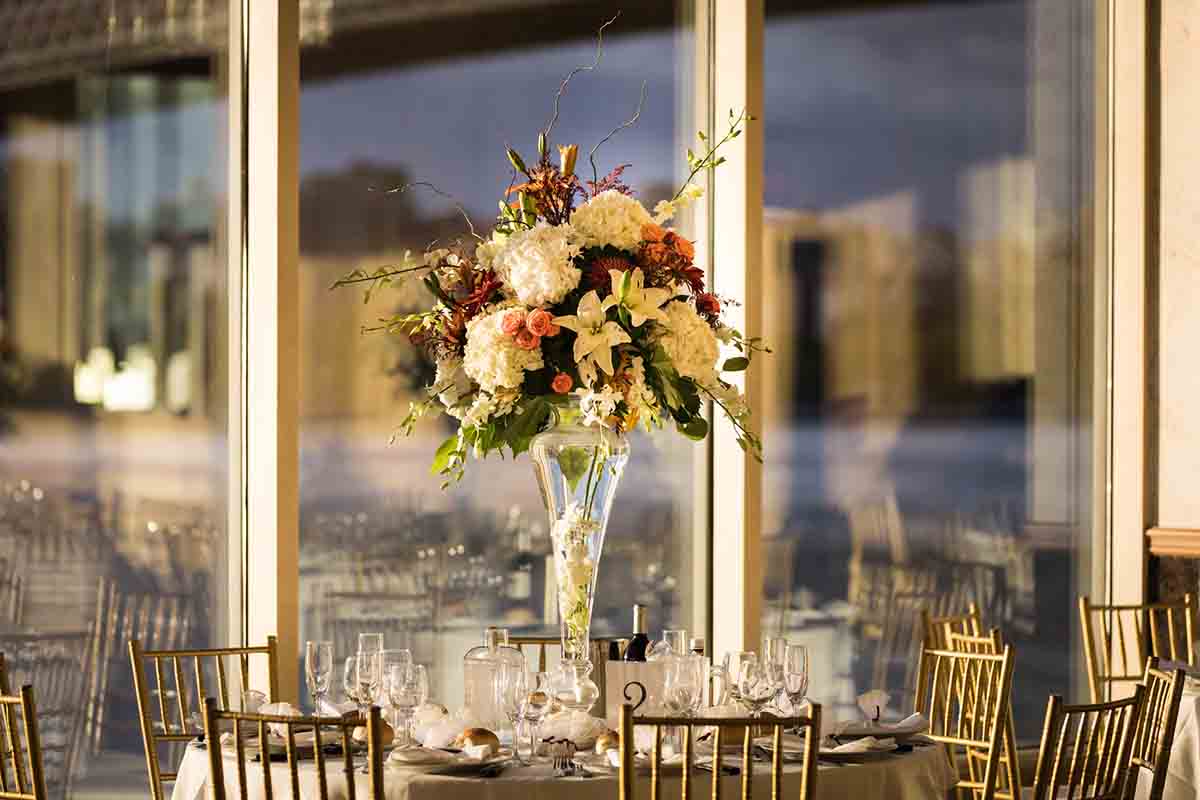 Table with flower centerpiece at Giando on the Water wedding