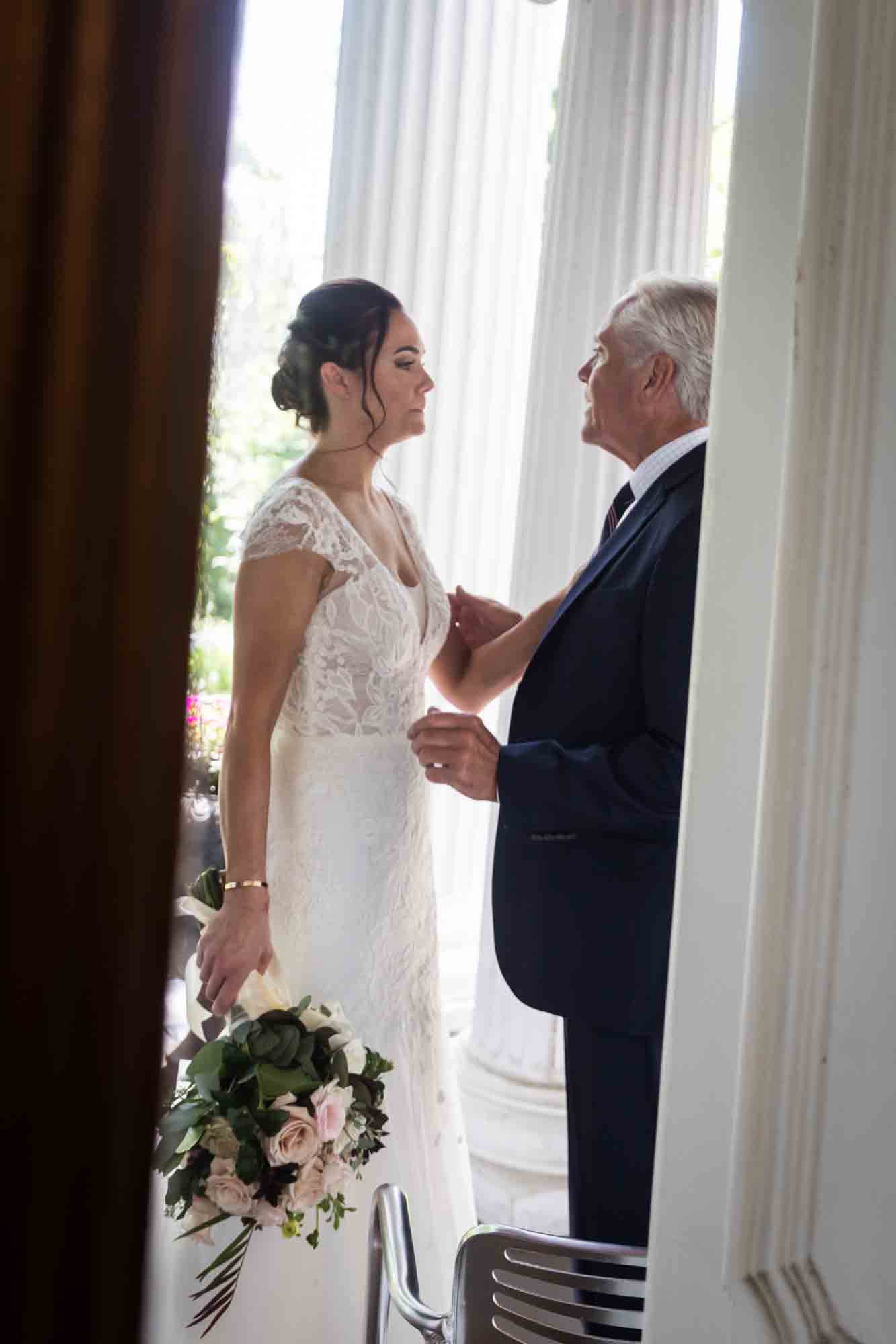 Bride speaking with father at a FEAST at Round Hill wedding