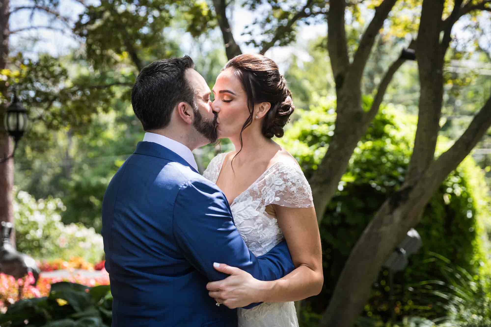 Bride and groom kissing after first look at a FEAST at Round Hill wedding