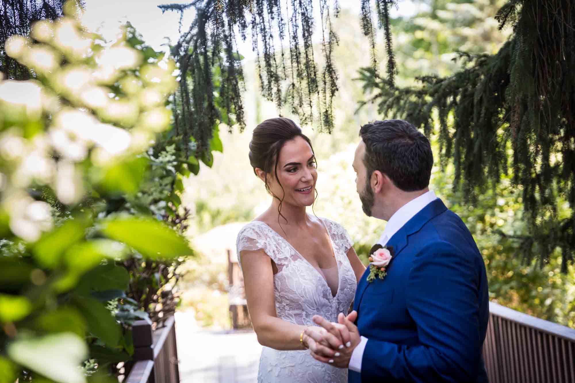 Bride and groom dancing in garden at a FEAST at Round Hill wedding