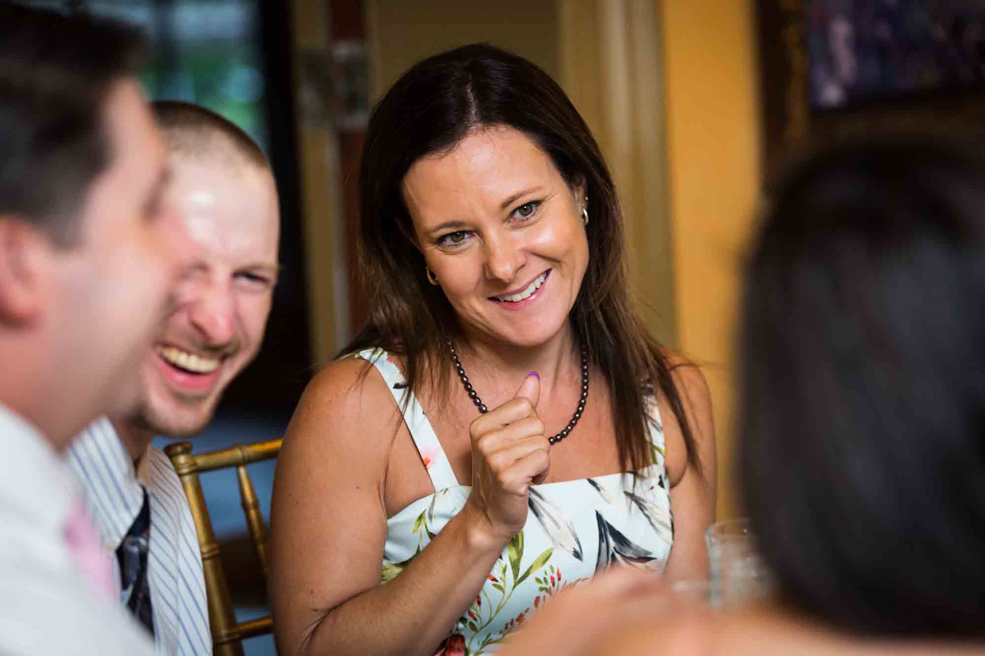 FEAST at Round Hill wedding photos of female guest smiling