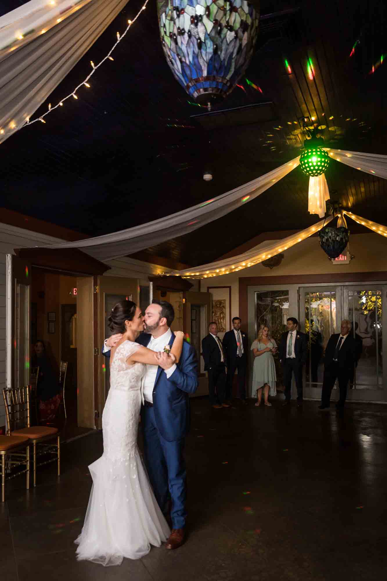 FEAST at Round Hill wedding photos of bride and groom kissing on dance floor