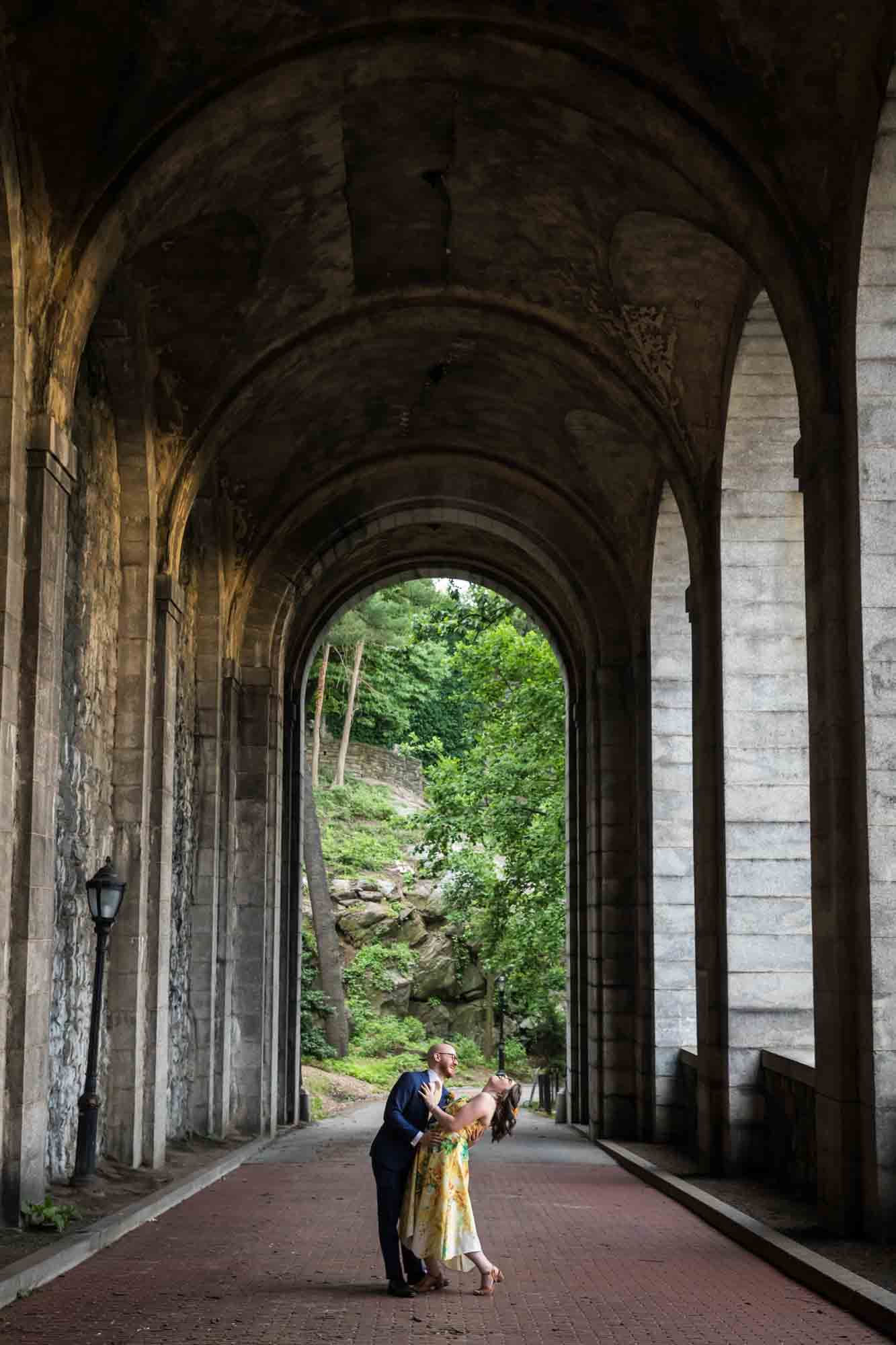 Bride and groom dancing under Billings Arcade for an article on how to select a wedding date