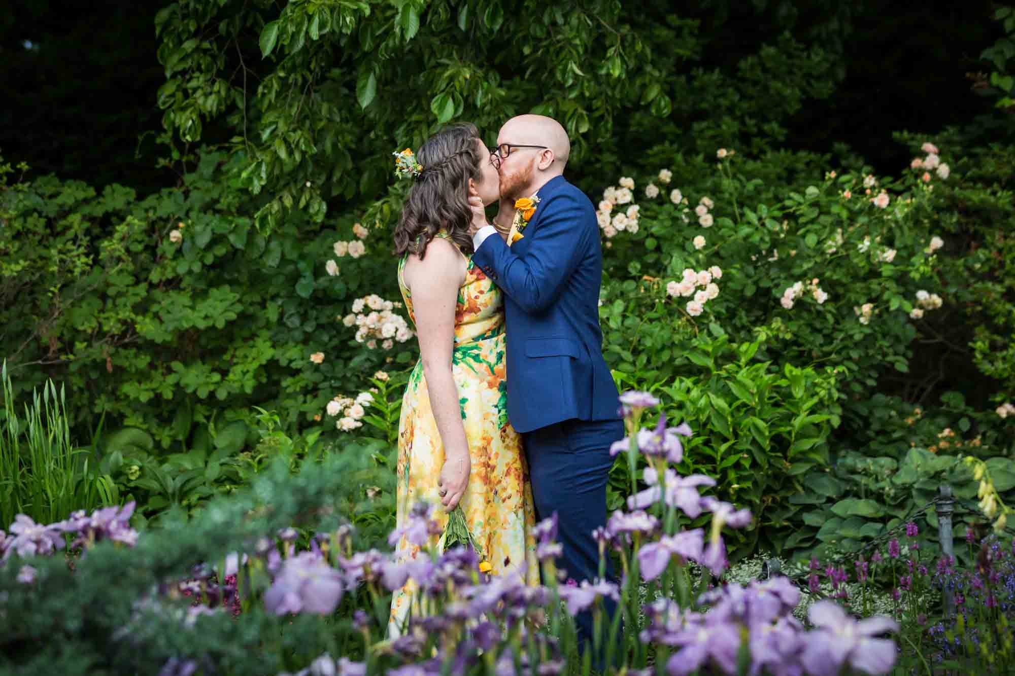 Fort Tryon wedding photos of bride and groom kissing in garden