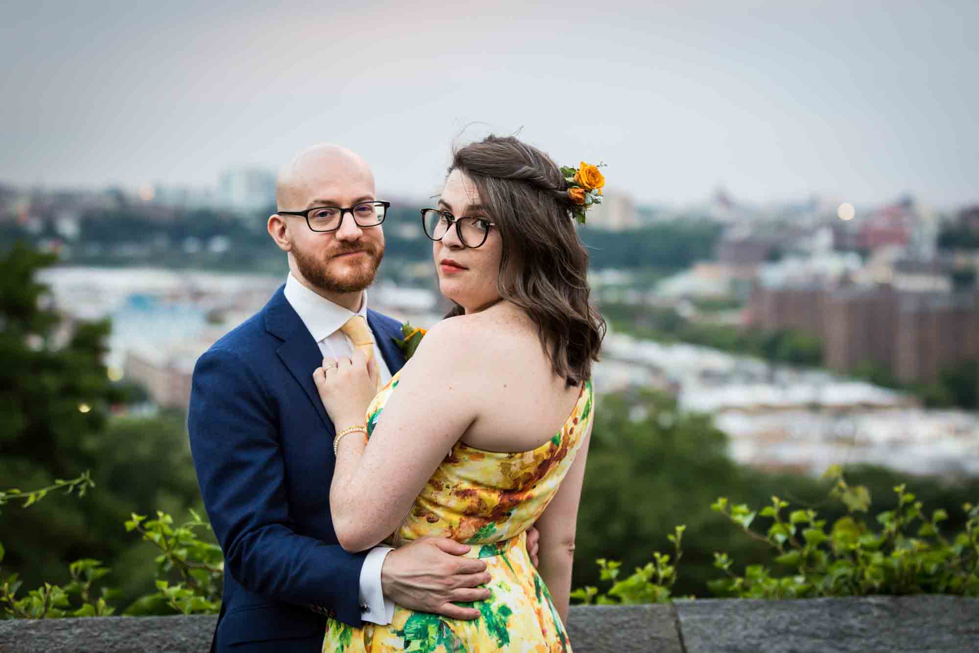 Bride and groom with NYC skyline in background for an article on how to select a wedding date