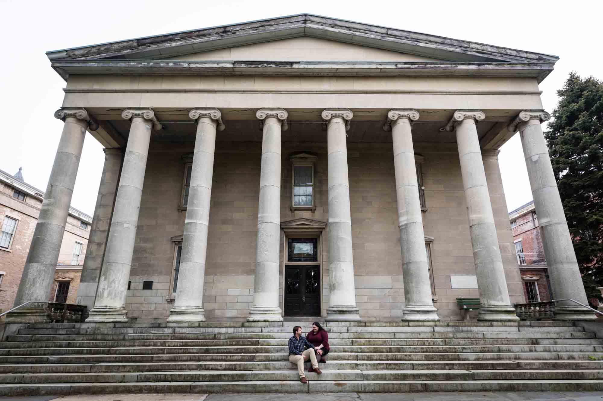 Snug Harbor engagement photos of couple on steps of Newhouse Center for Contemporary Art