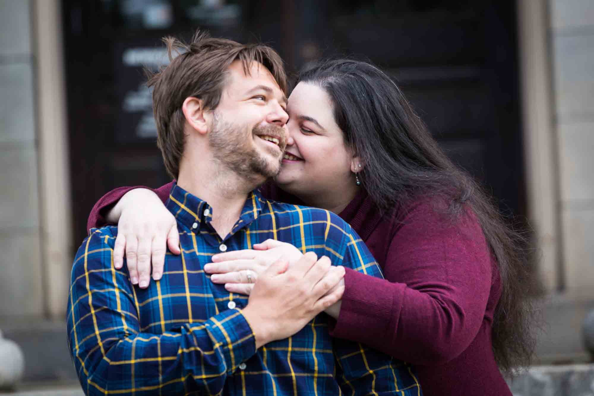 Snug Harbor engagement photos of couple hugging