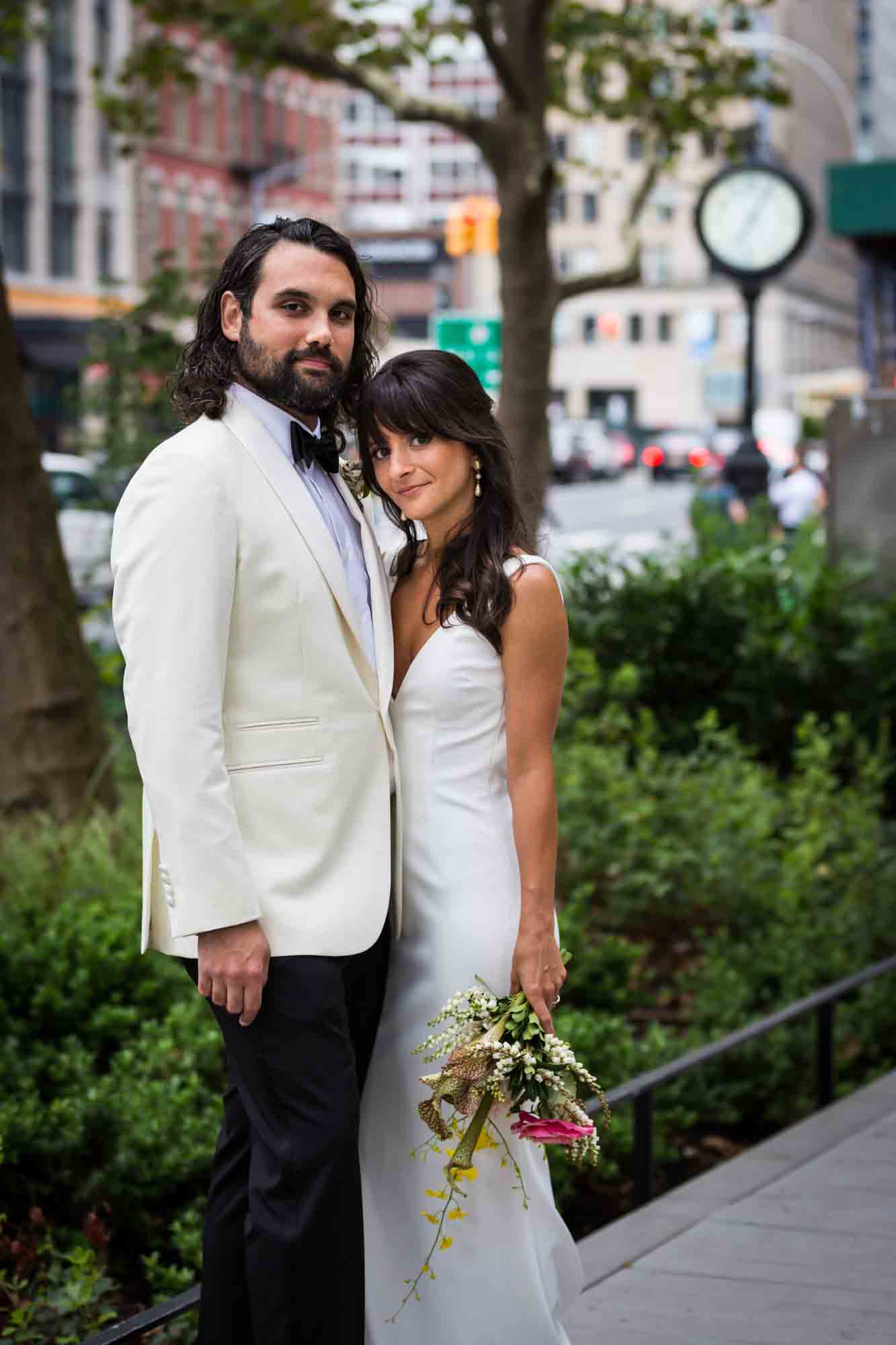 Bride and groom standing in NYC Tribeca for article on wedding bouquet photo tips