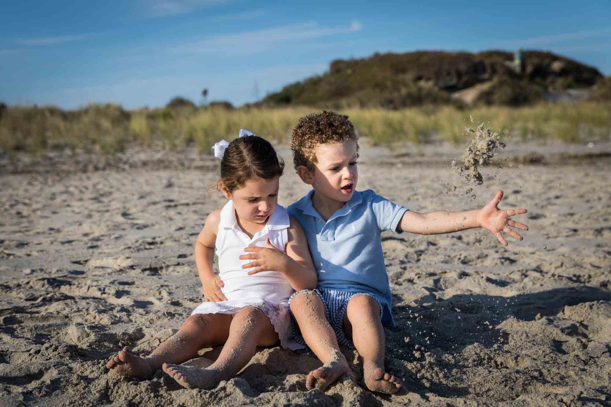 Fort Tilden beach family portrait of two small children sitting on a beach