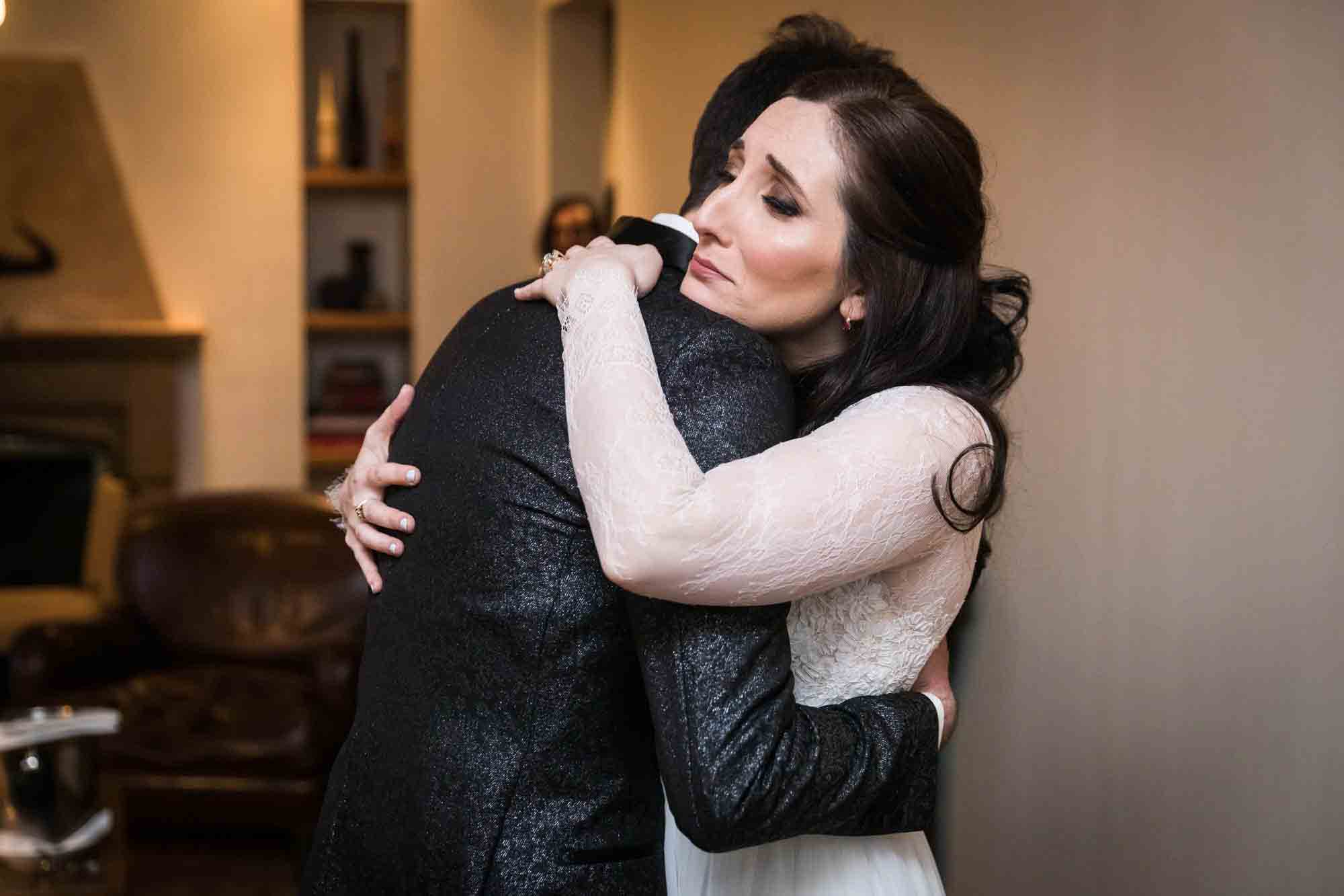 Bride hugging groom during first look