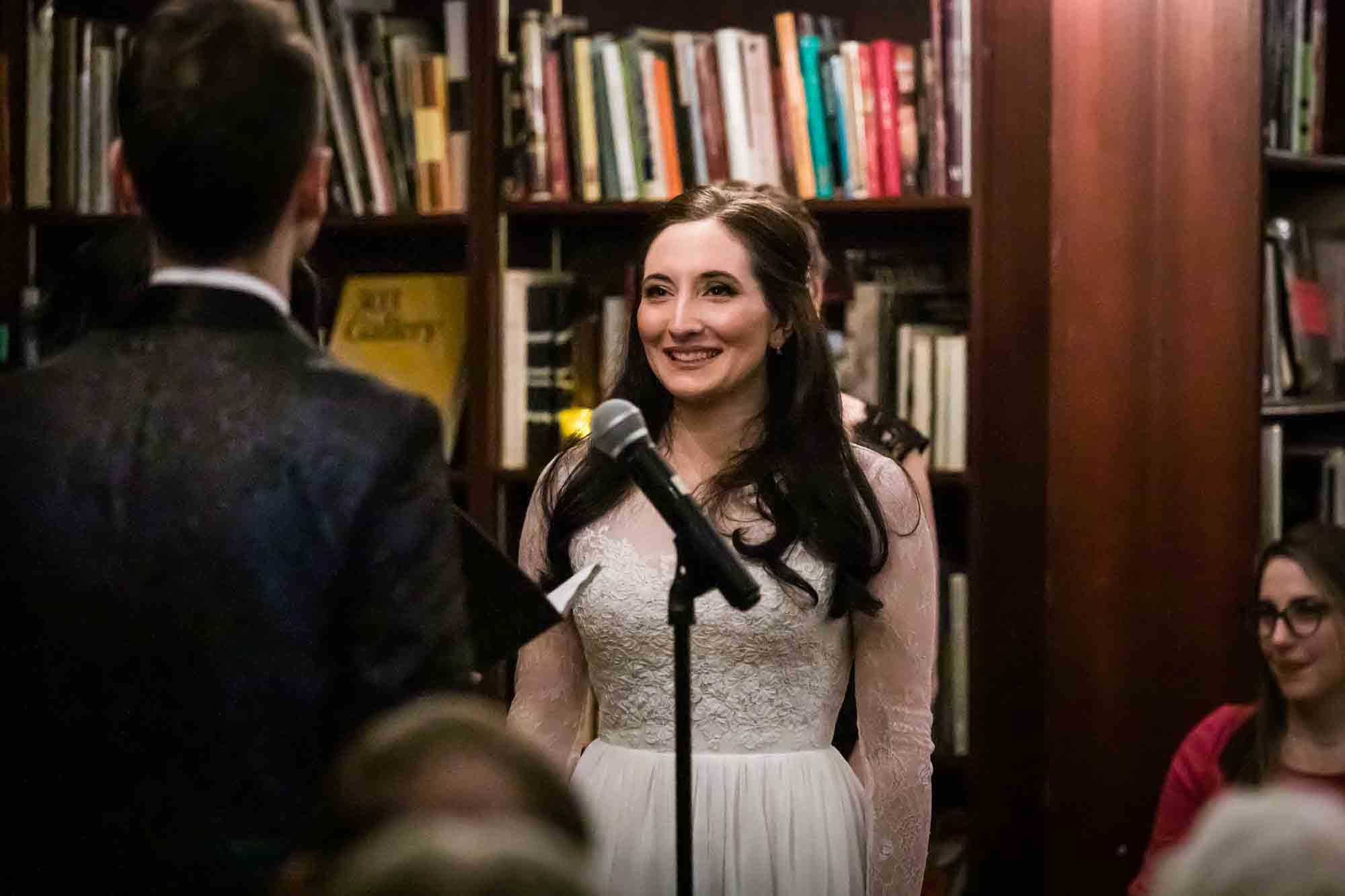 Bride listening to groom during ceremony for an article on wedding ceremony photo tips