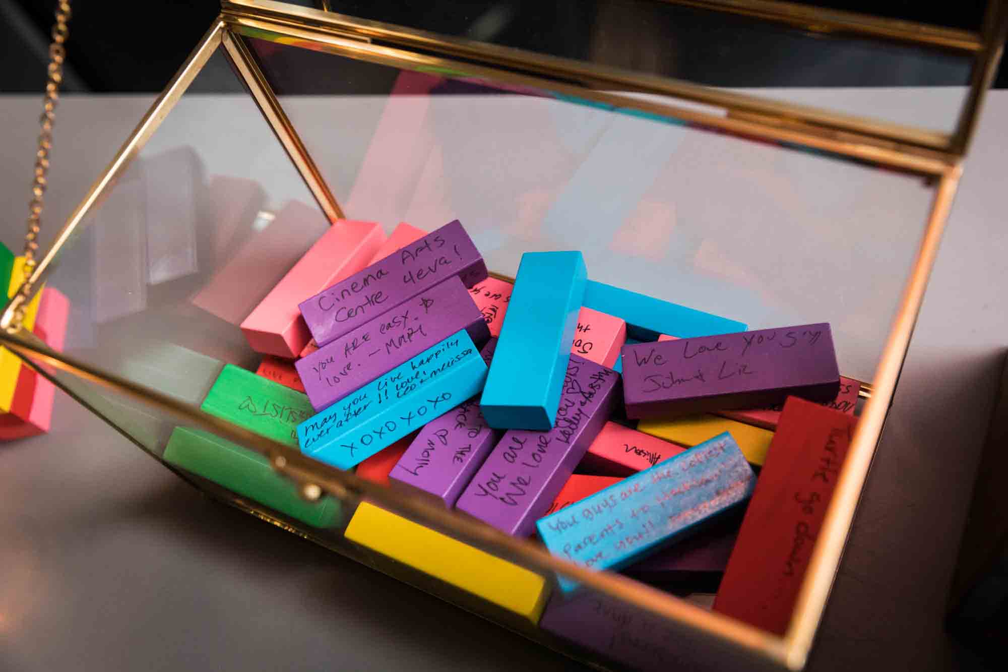 Colorful Jenga blocks with writing on them