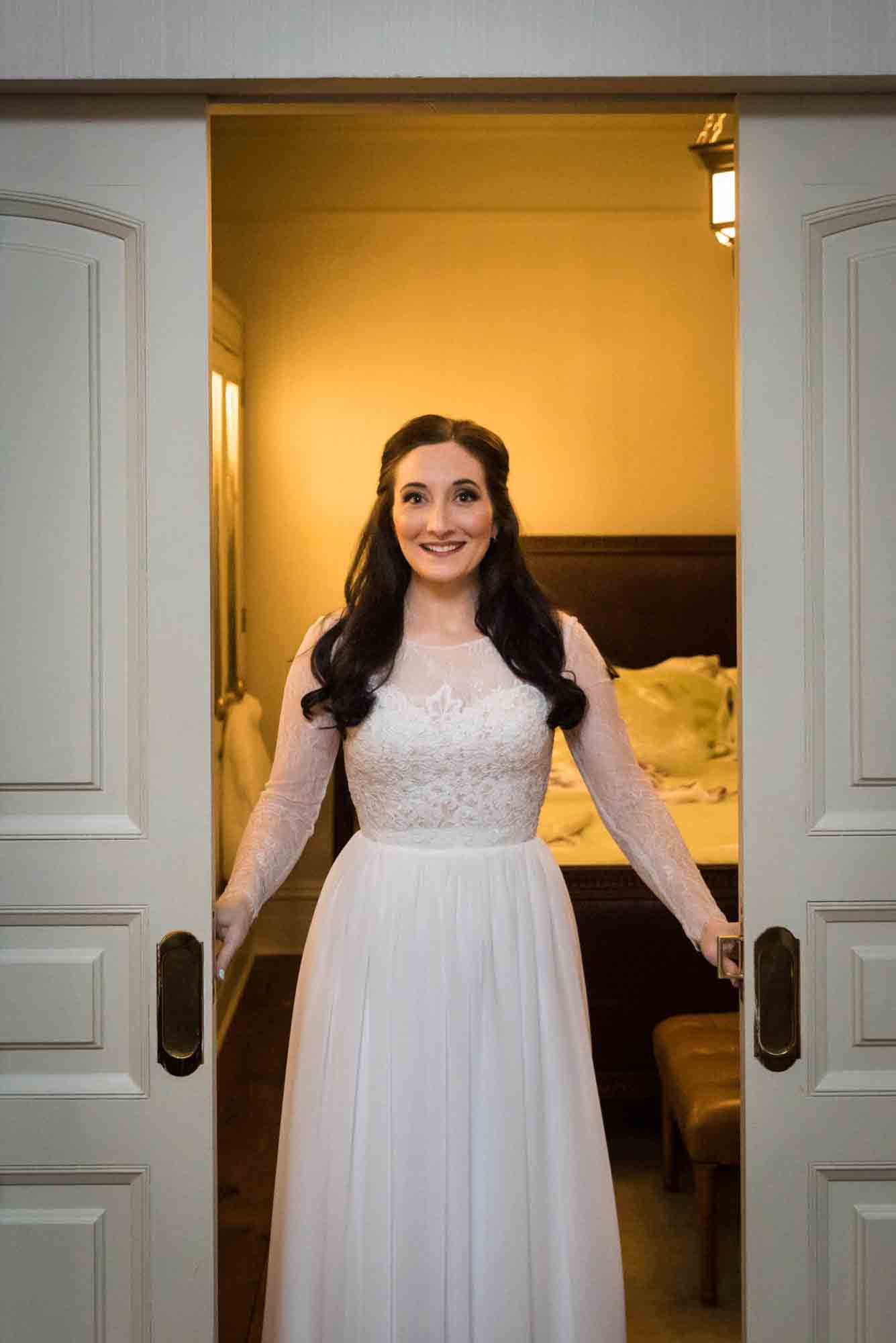 Bride in white dress opening doors