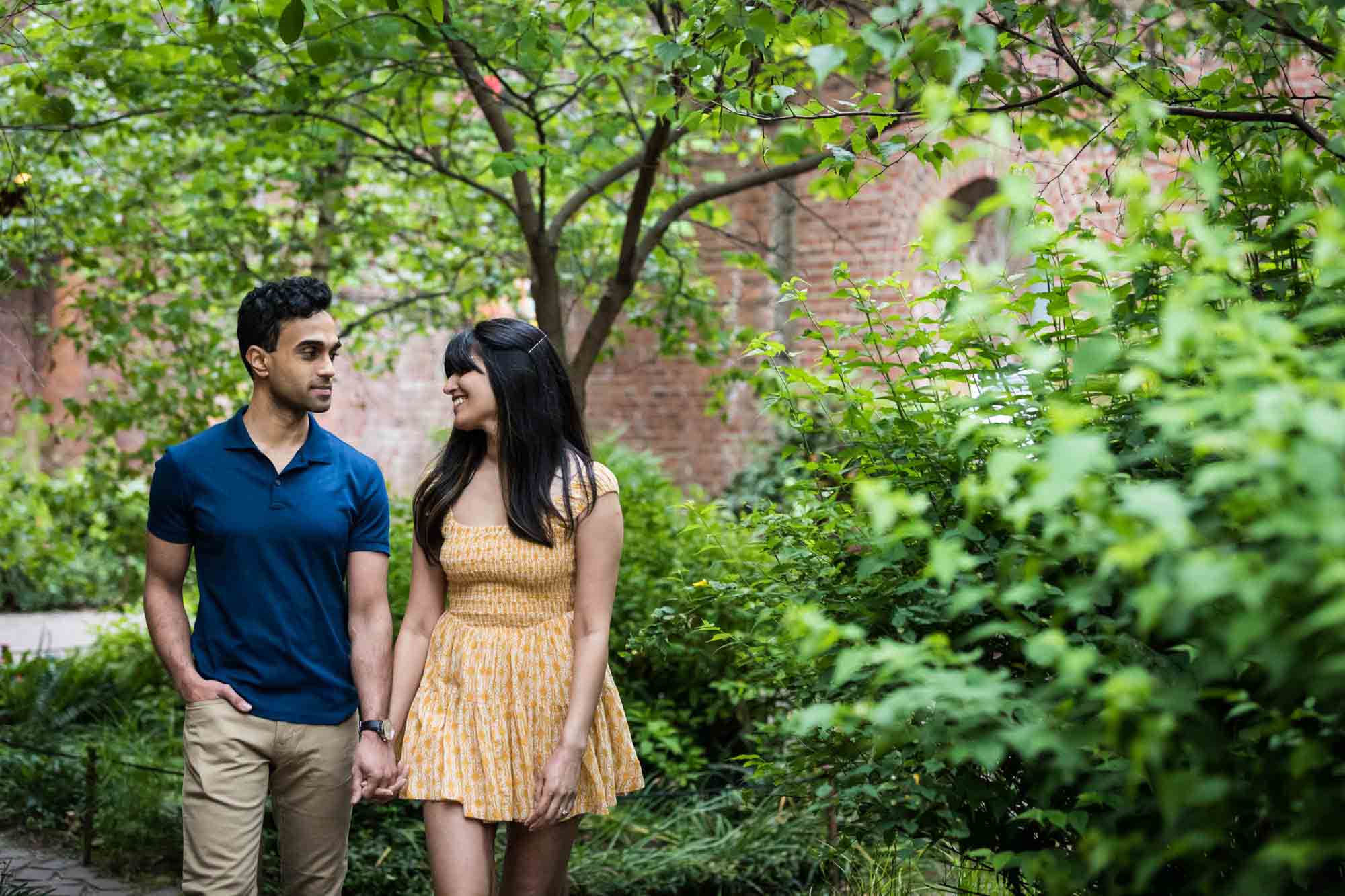 Couple walking in garden at Brooklyn Bridge Park