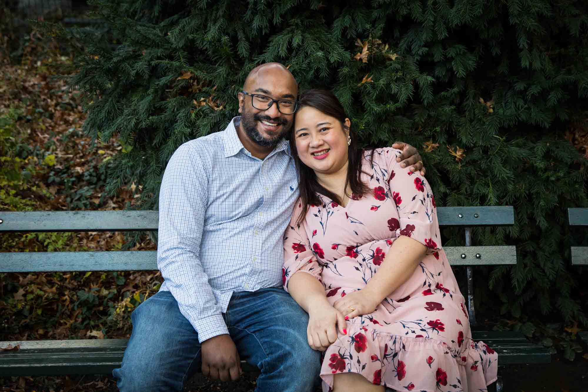 Central Park portrait of couple hugging together on bench