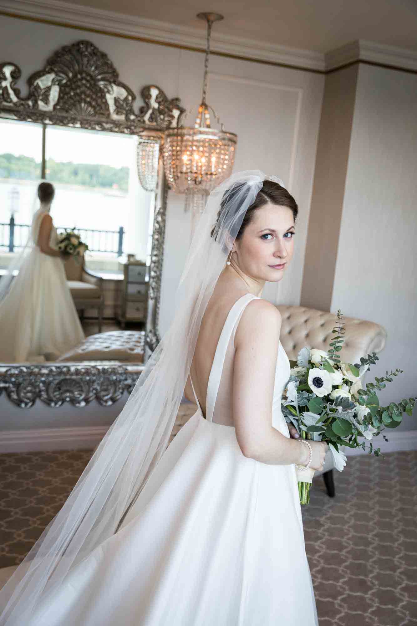 Glen Island Harbour Club wedding photos of bride wearing veil and holding bouquet in bridal suite