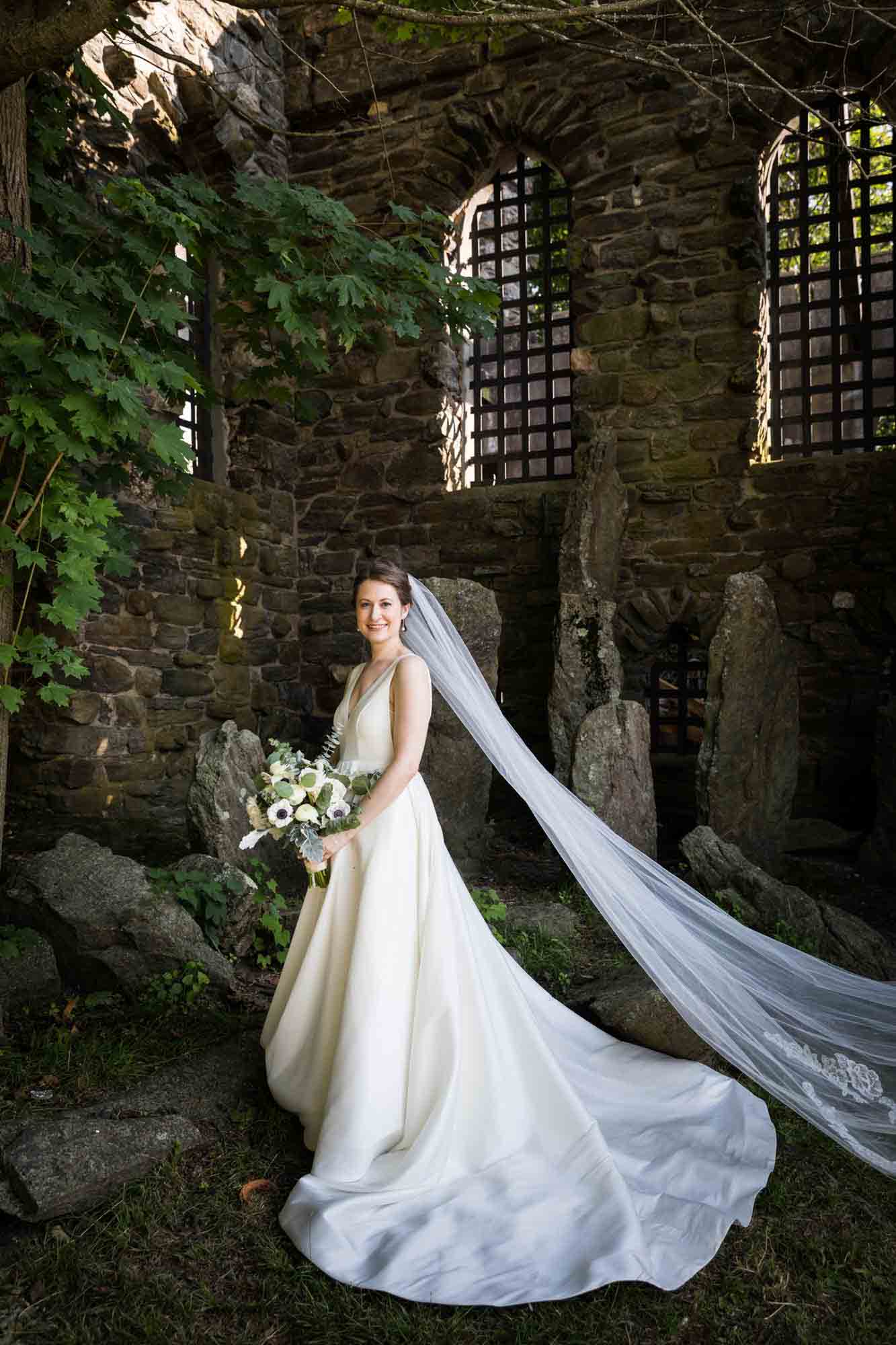 Glen Island Park wedding photo of bride wearing veil in front of castle ruins