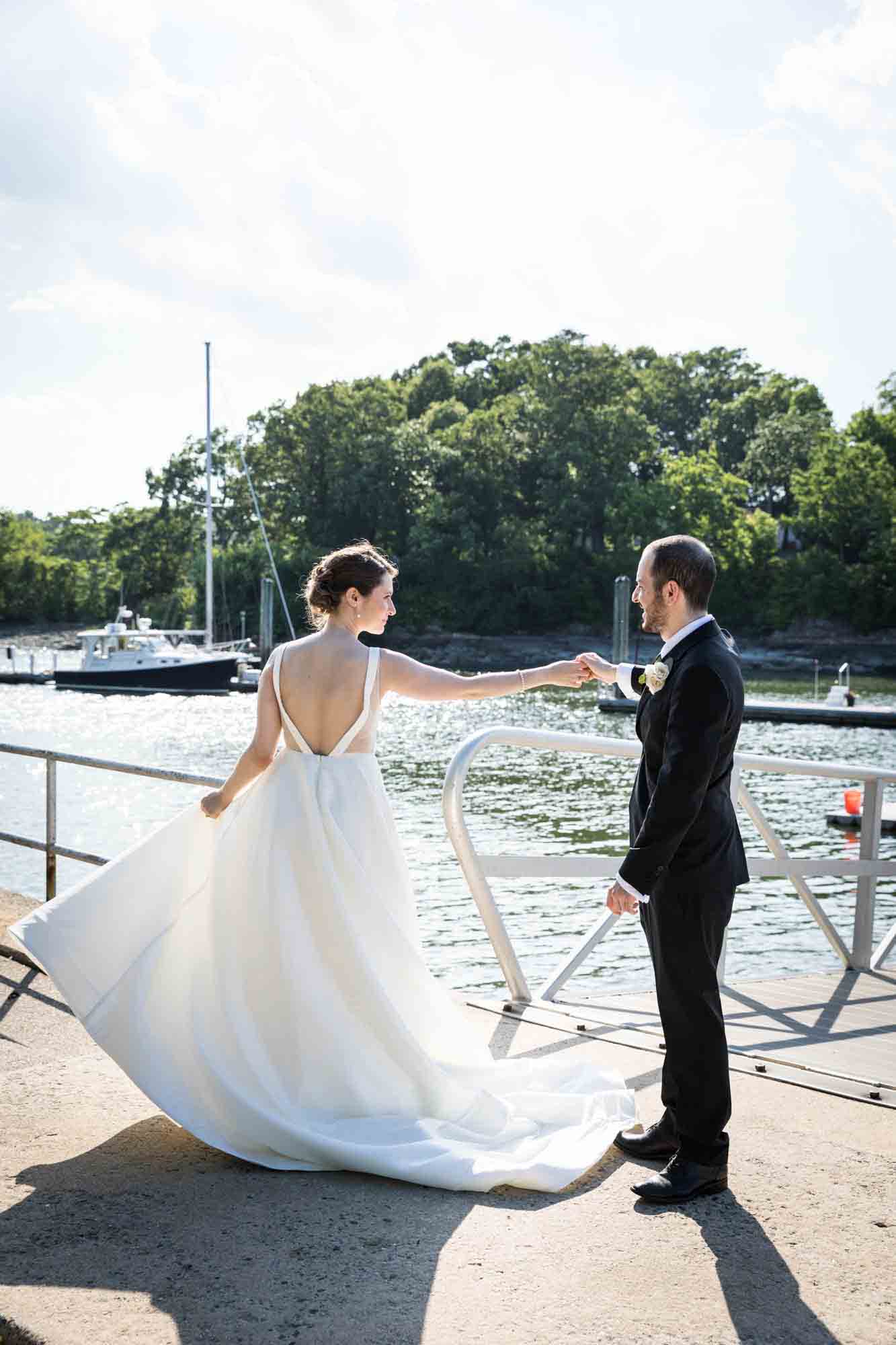 Glen Island Harbour Club wedding photos of bride and groom dancing on dock in front of water