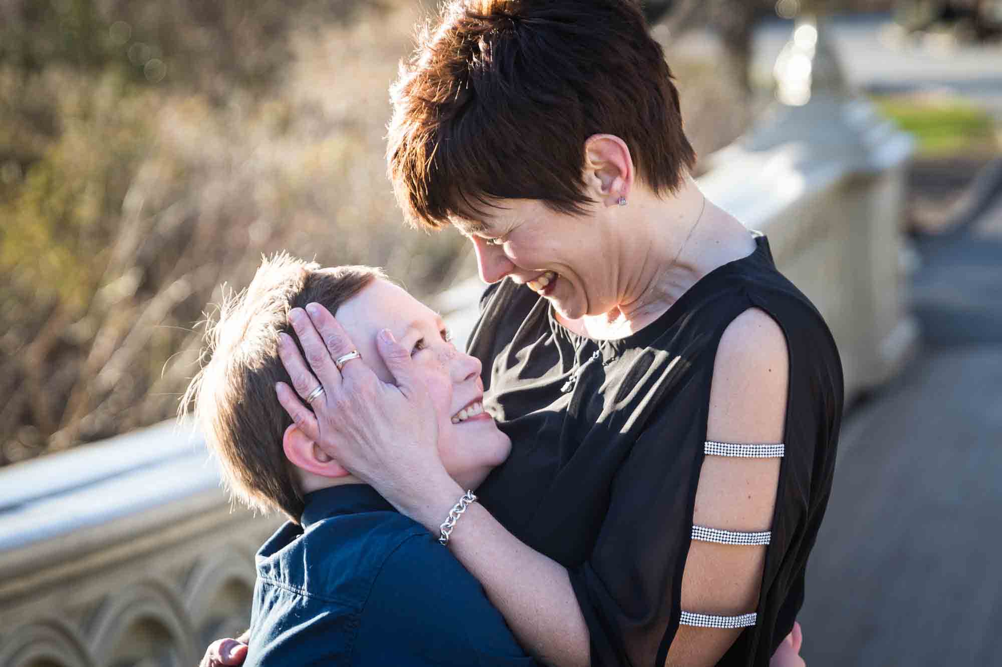 Mother caressing son's head for an article advertising family portrait gift certificates