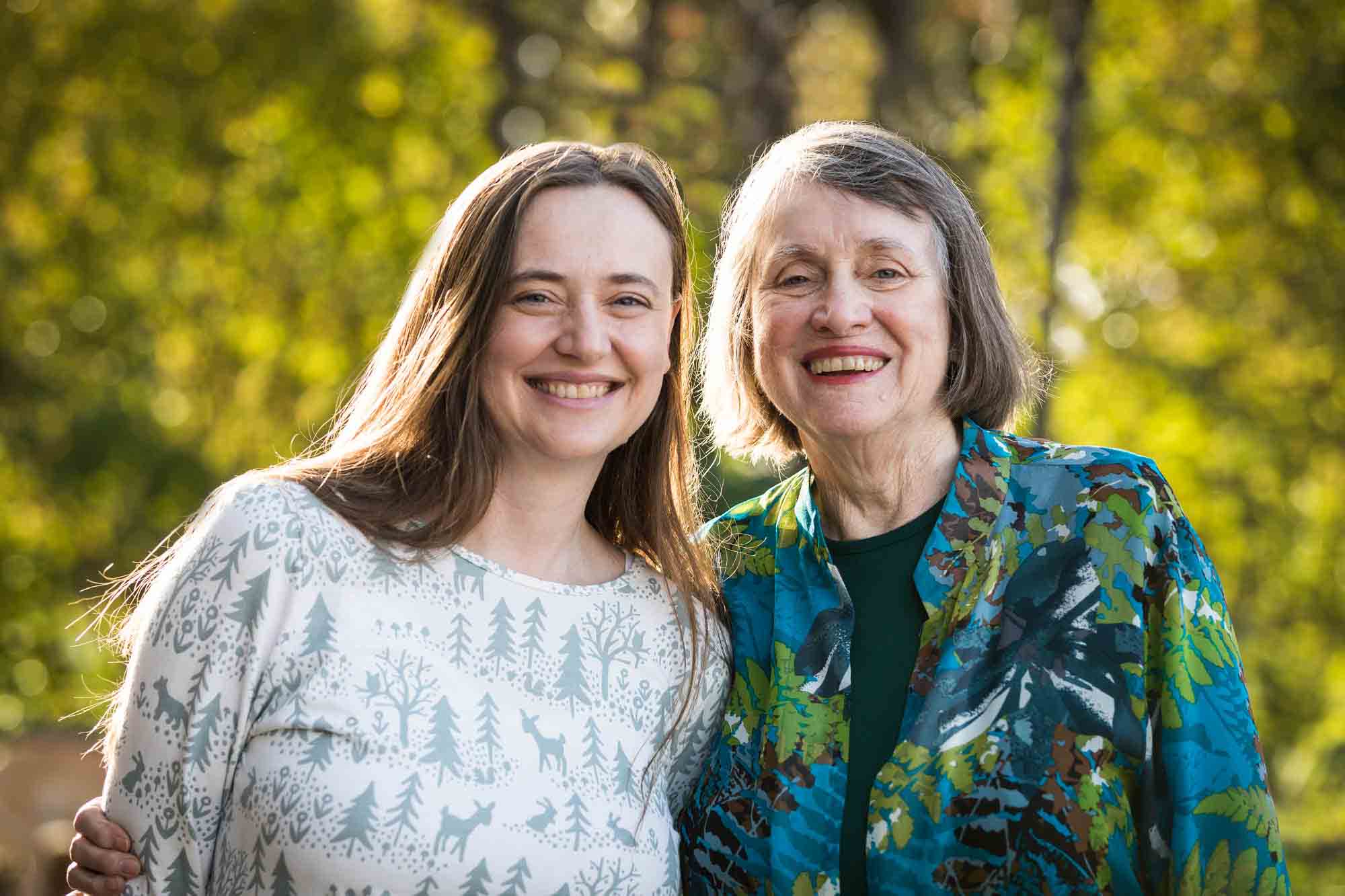 Woman and mother smiling for portrait in Brooklyn Bridge Park