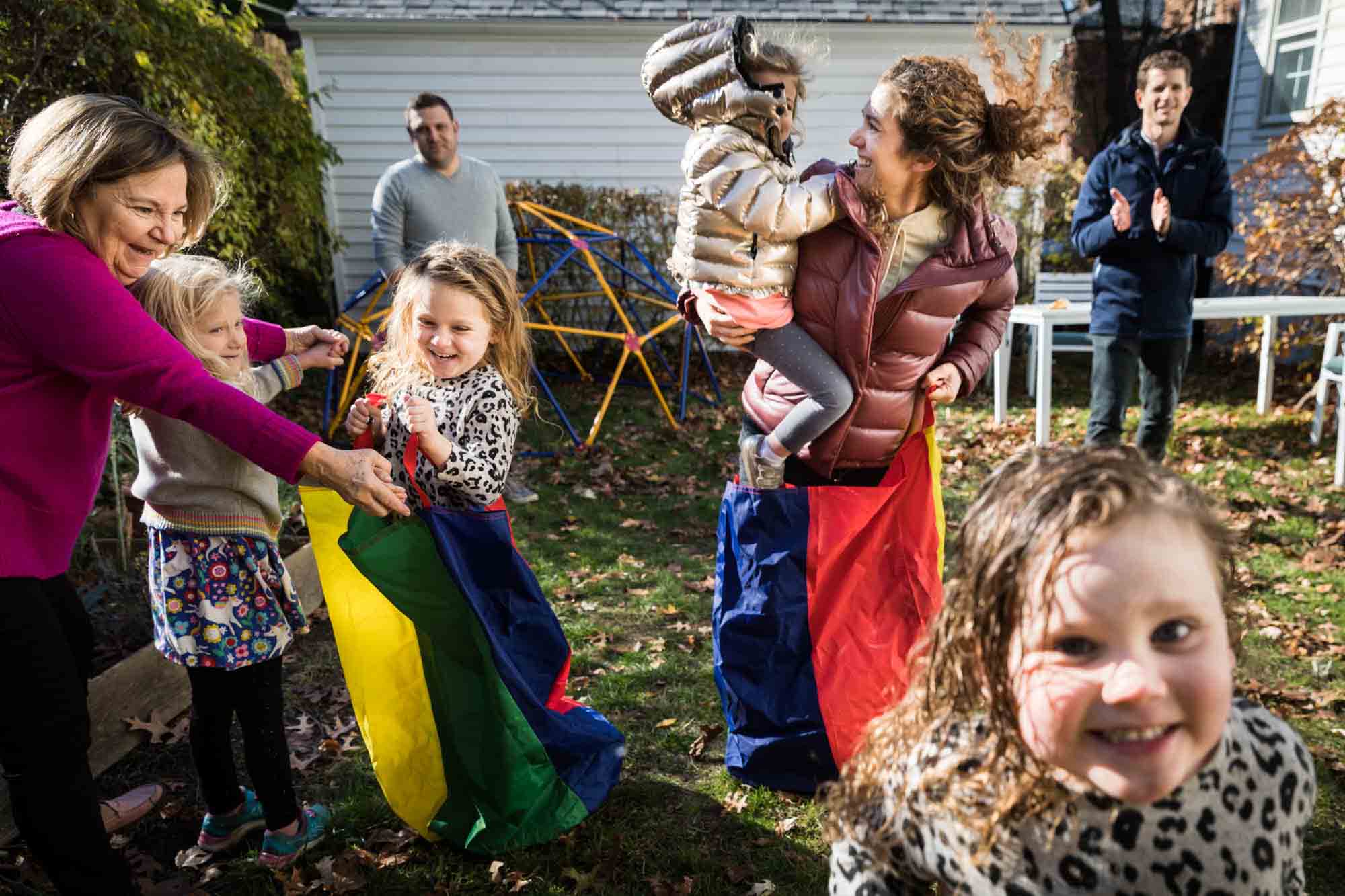 Chaotic scene of family playing in backyard