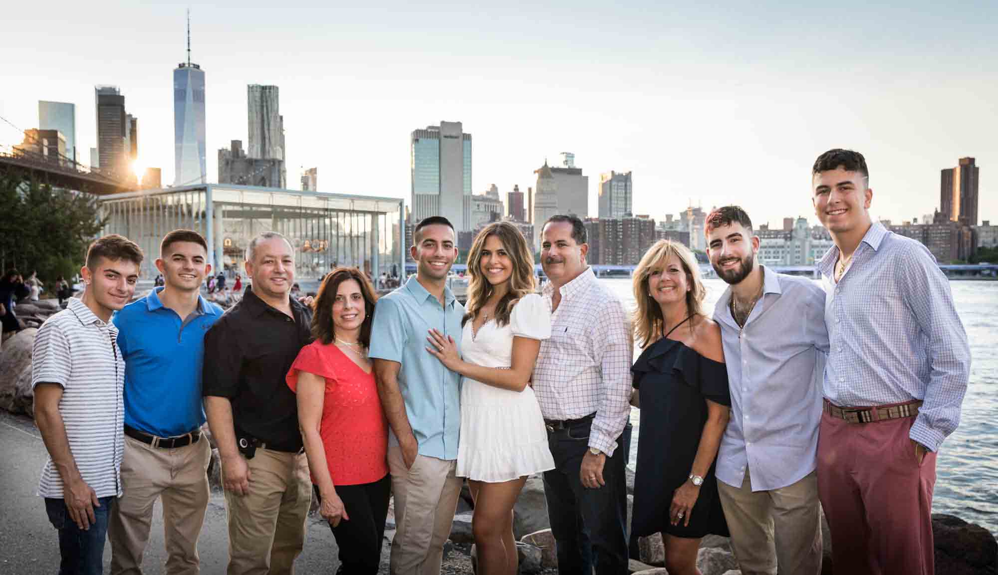 Couple with family in Brooklyn Bridge Park