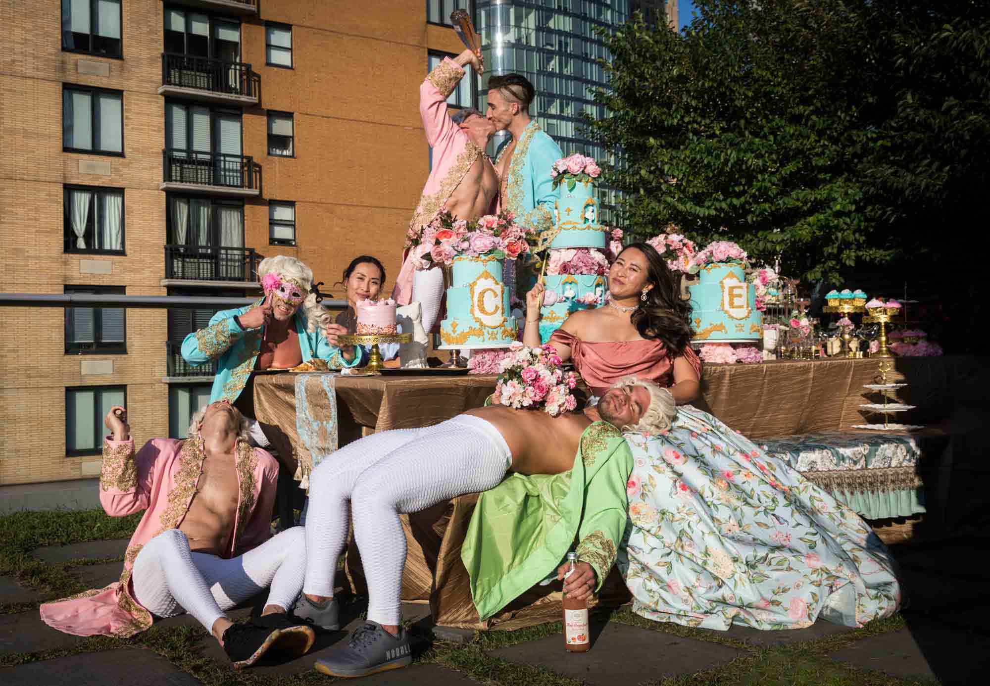 Woman and male guests dressed as Marie Antoinette and court for an article on event planning photography tips