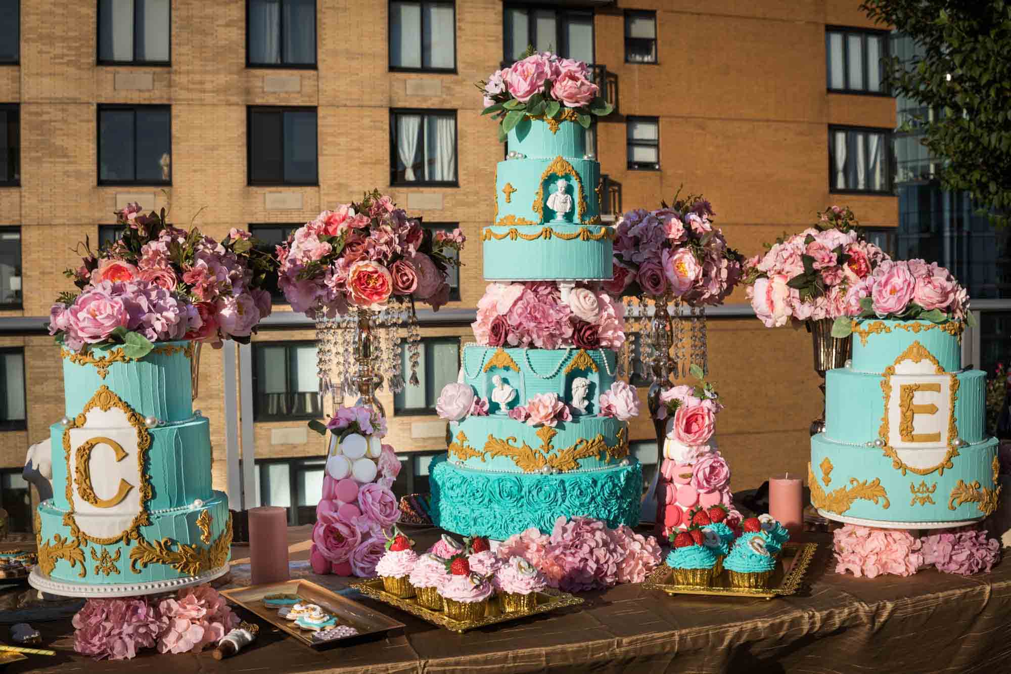Table filled with elaborate cakes and cupcakes for an article on event planning photography tips