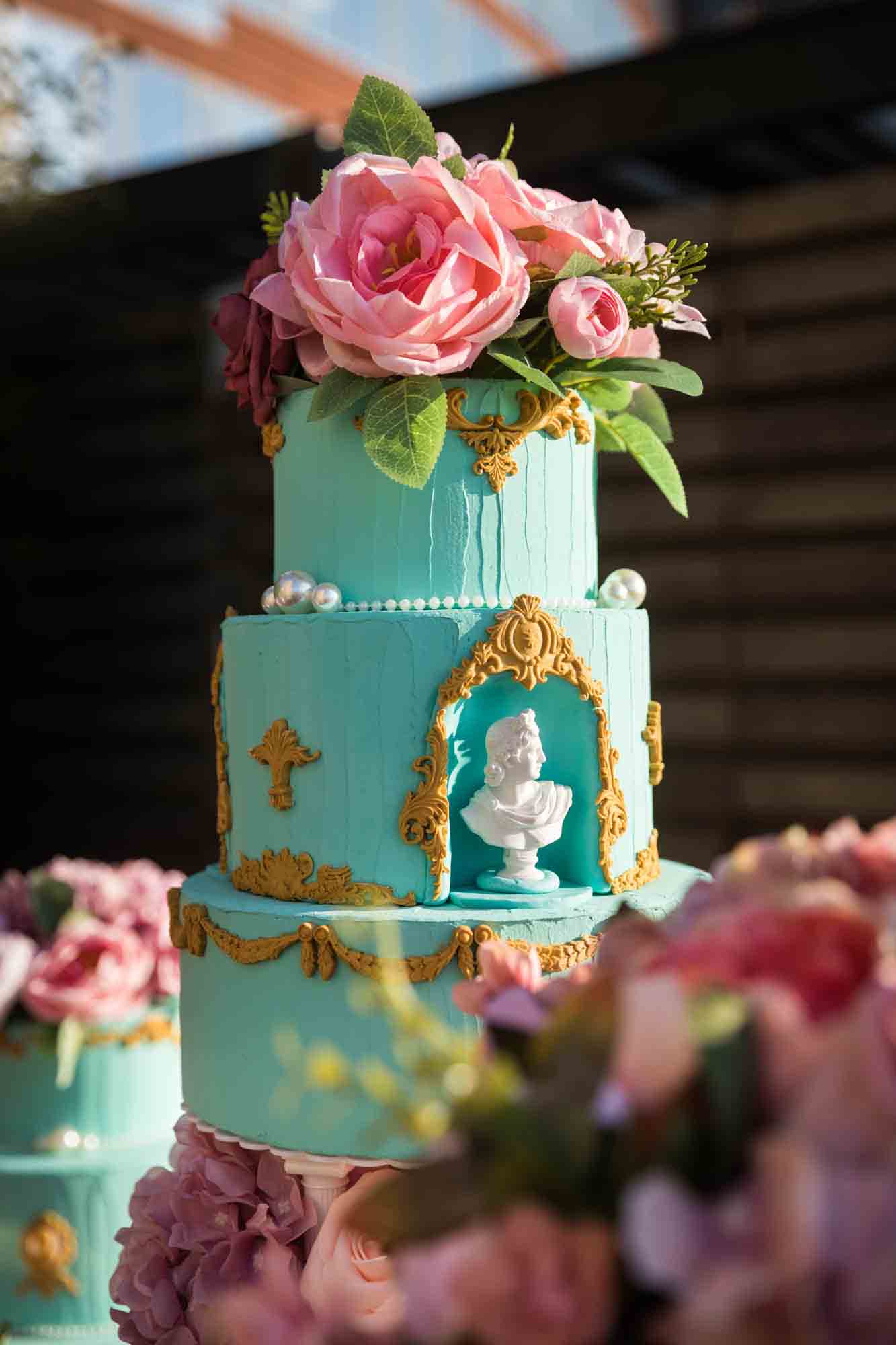 Table filled with elaborate cakes and cupcakes for an article on event planning photography tips