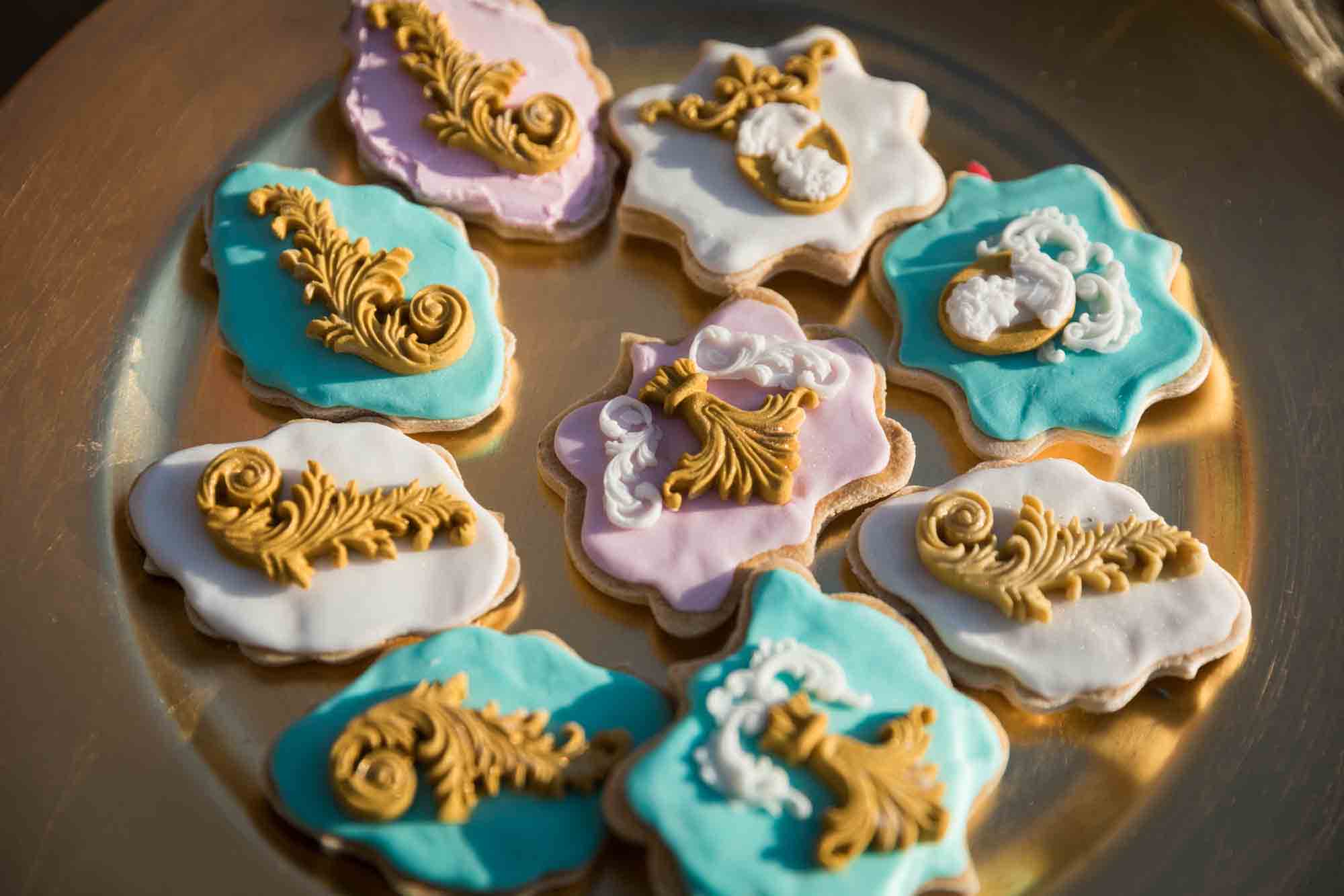 Pink and white elaborately decorated cookies