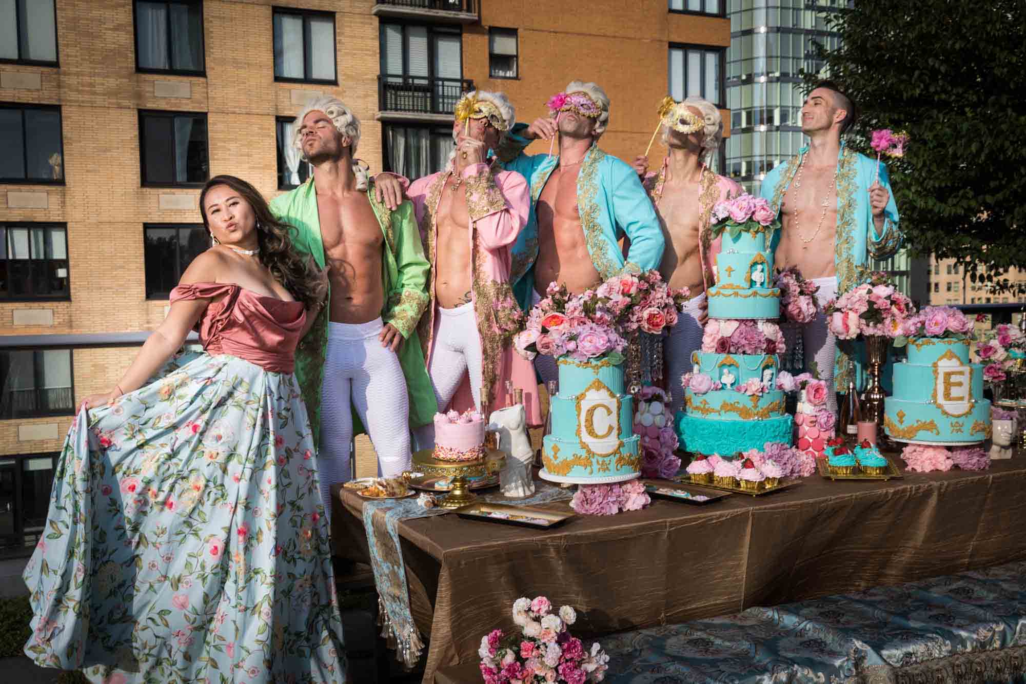 Woman and men dressed as French courtiers and wearing masks for an article on event planning photography tips