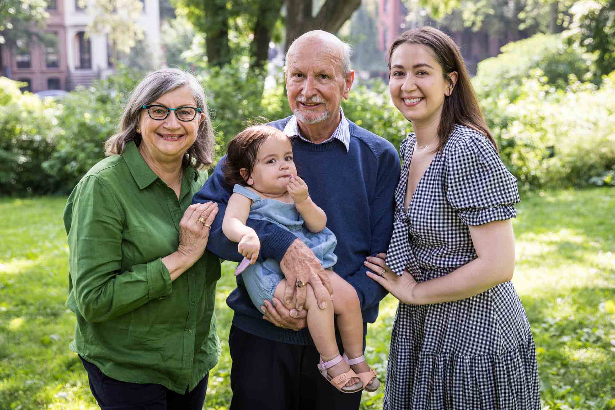 Grandparents, mother, and little girl during a Fort Greene Park family portrait