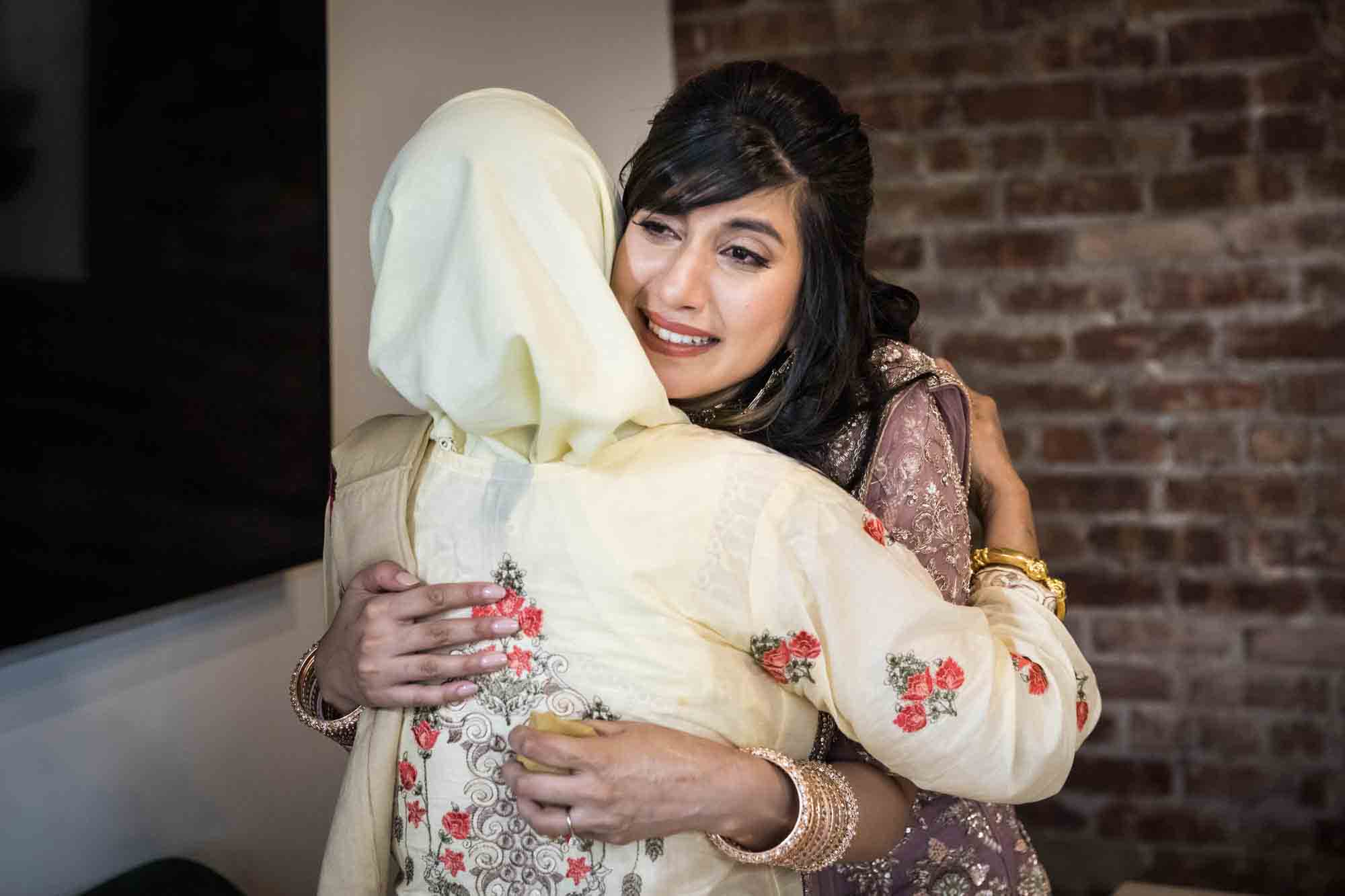 Bride hugging female family member at Loft Story wedding