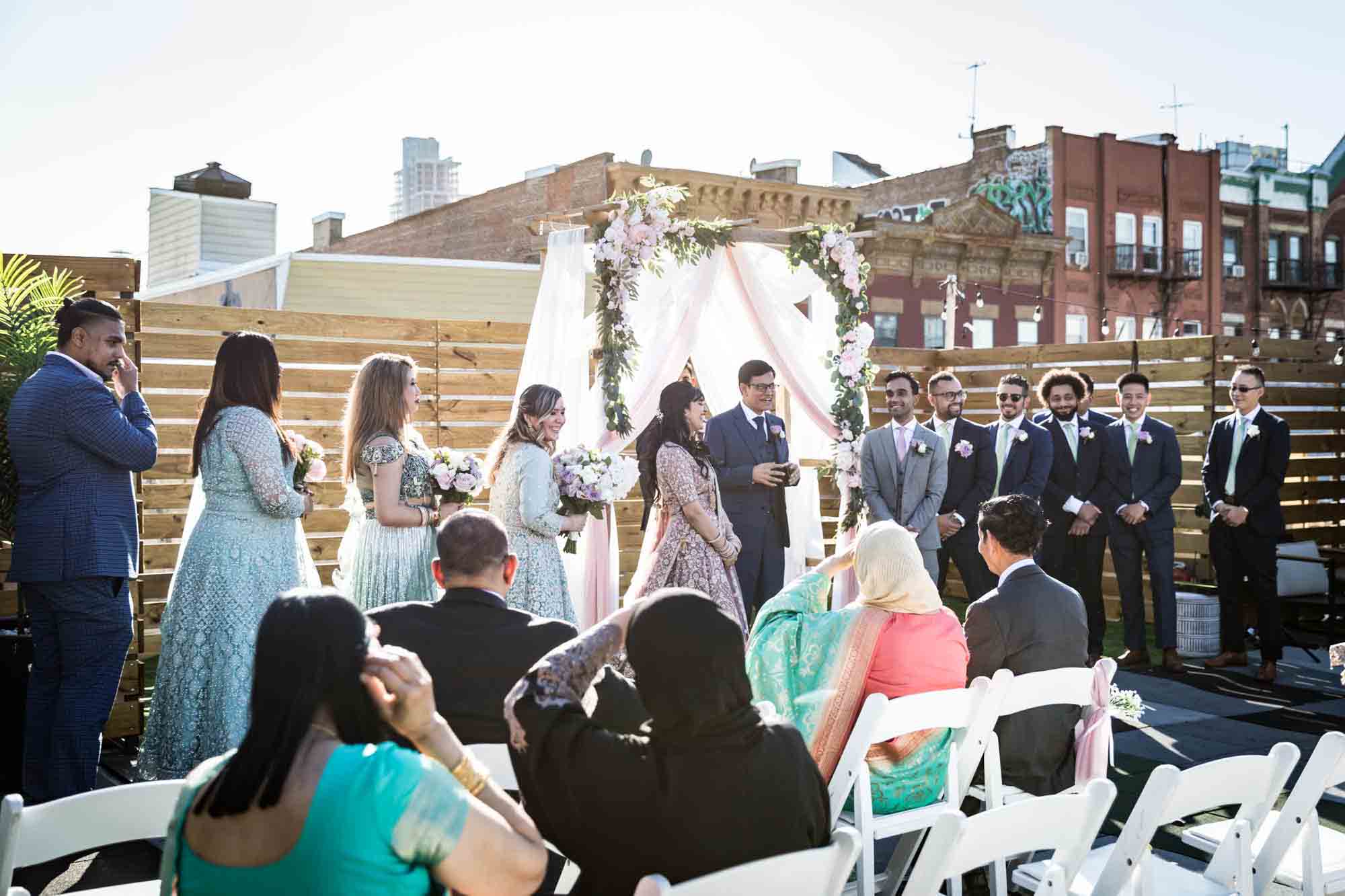Ceremony on rooftop at Loft Story for article on wedding reception game ideas
