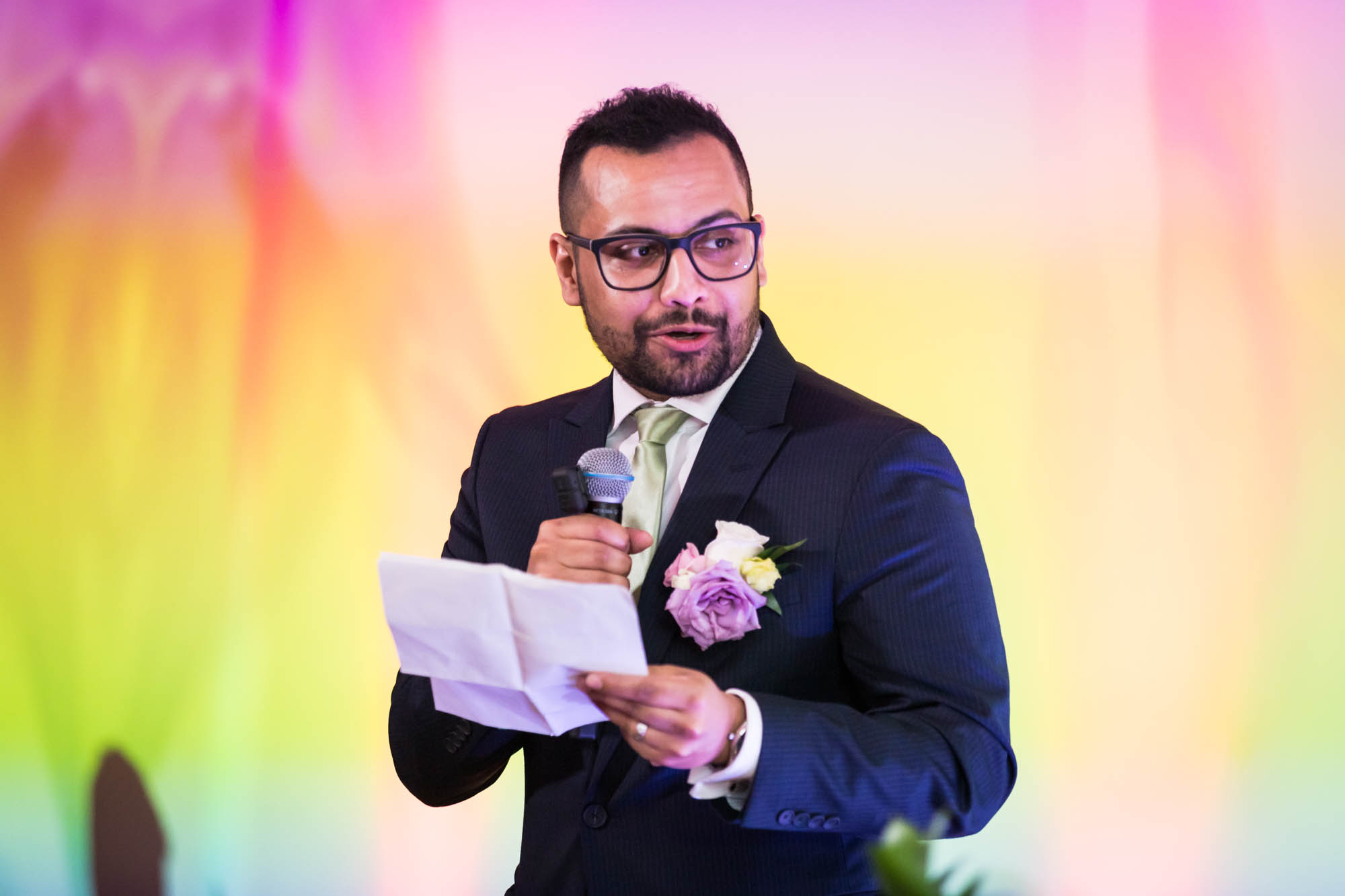 Man holding paper and making speech at a Loft Story wedding