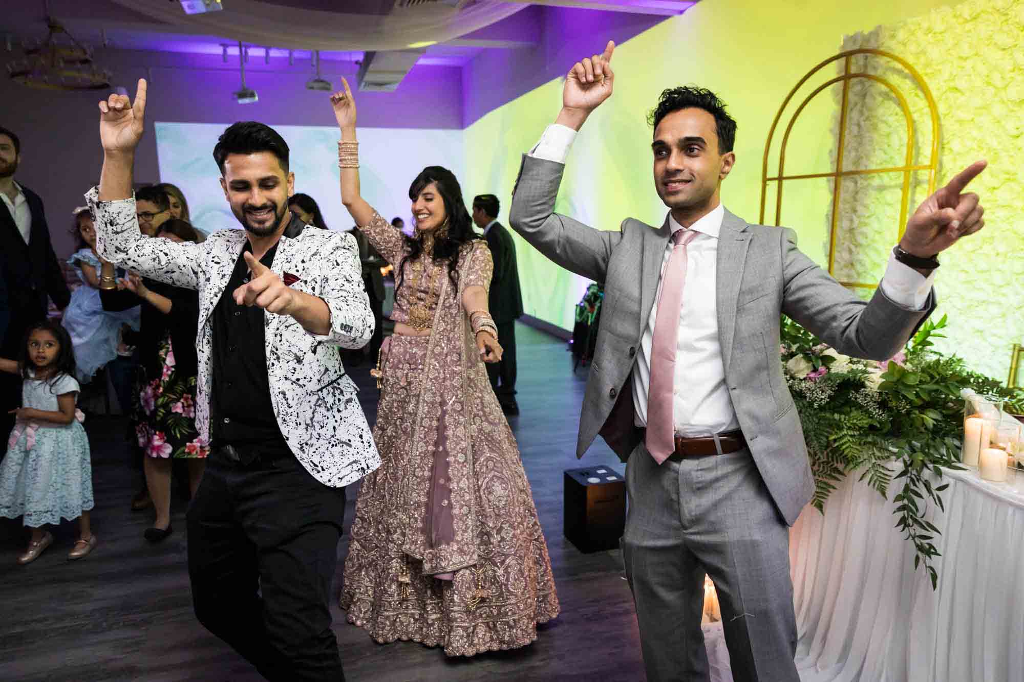 DJ dancing with Indian bride and groom at a Loft Story wedding