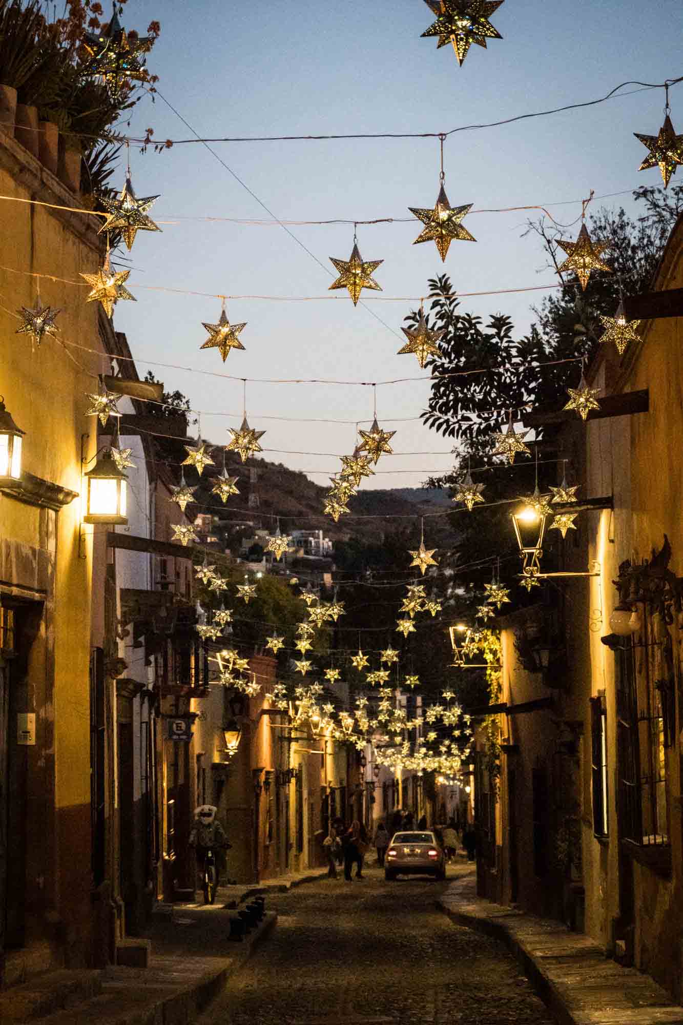 Star-shaped lights at night on the streets of San Miguel de Allende