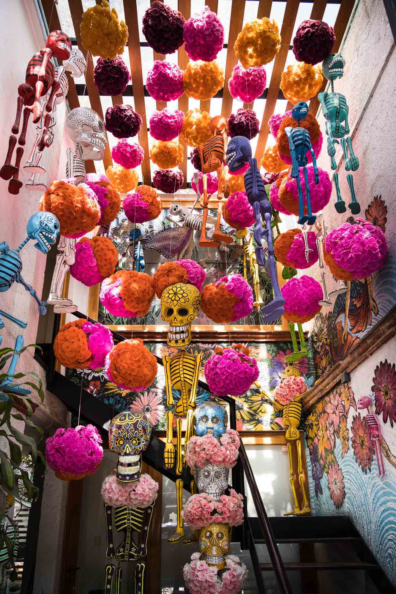 Colorful decorations and skeletons outside a shop in Mexico City