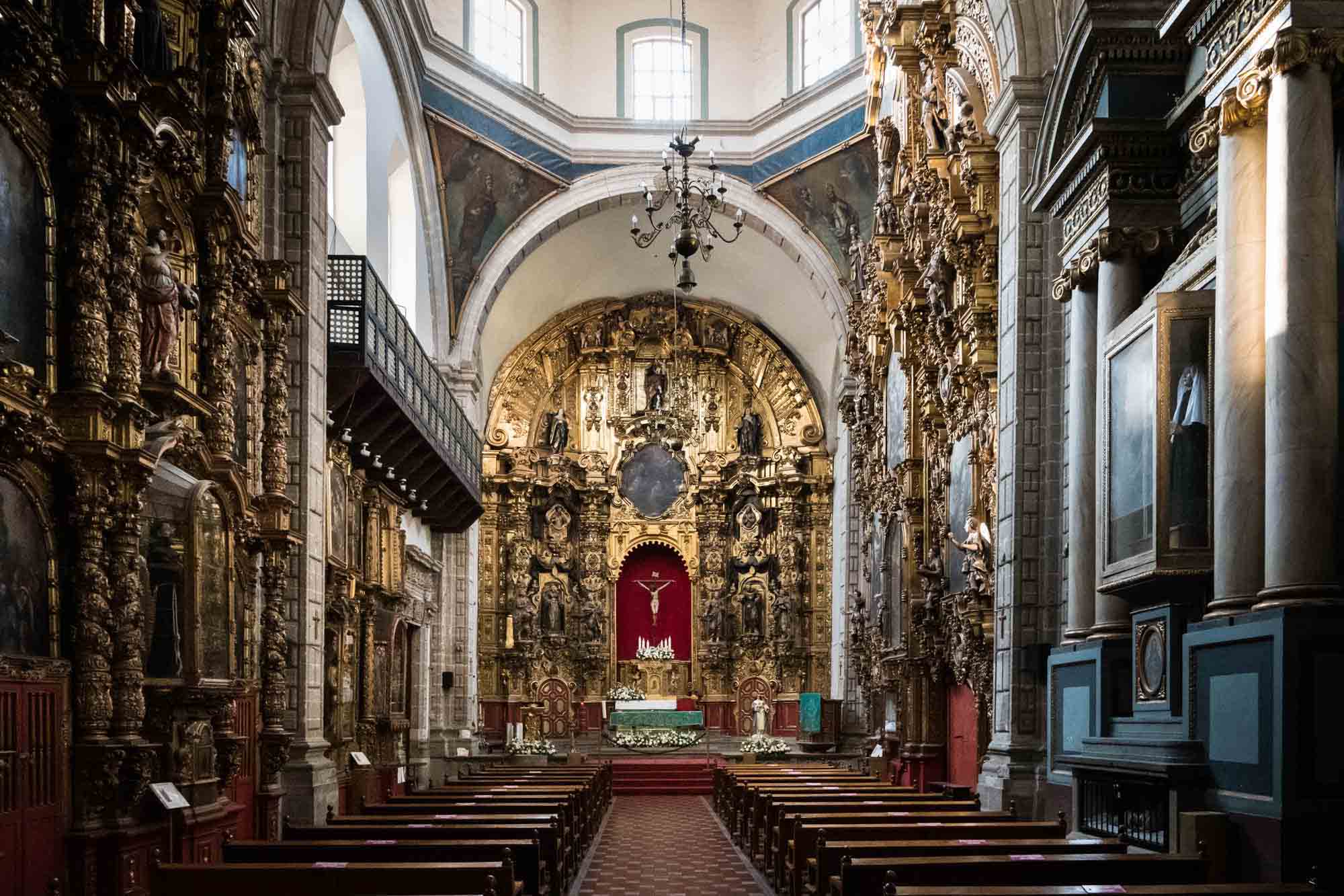 The gilded interior of the Regina Coeli parish in Mexico City