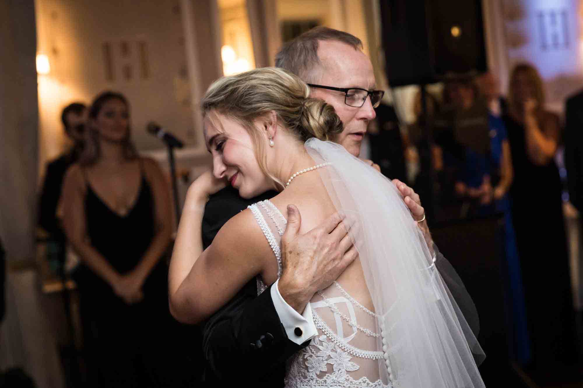 Father and bride hugging on dance floor at a Briarcliff Manor wedding