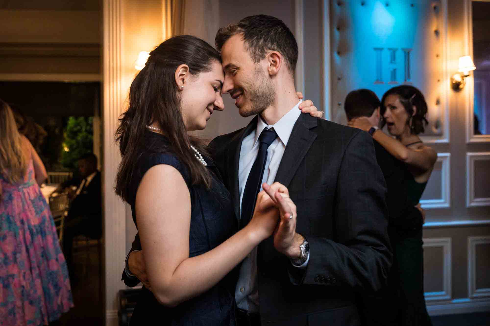 Couple dancing with heads touching at a Briarcliff Manor wedding
