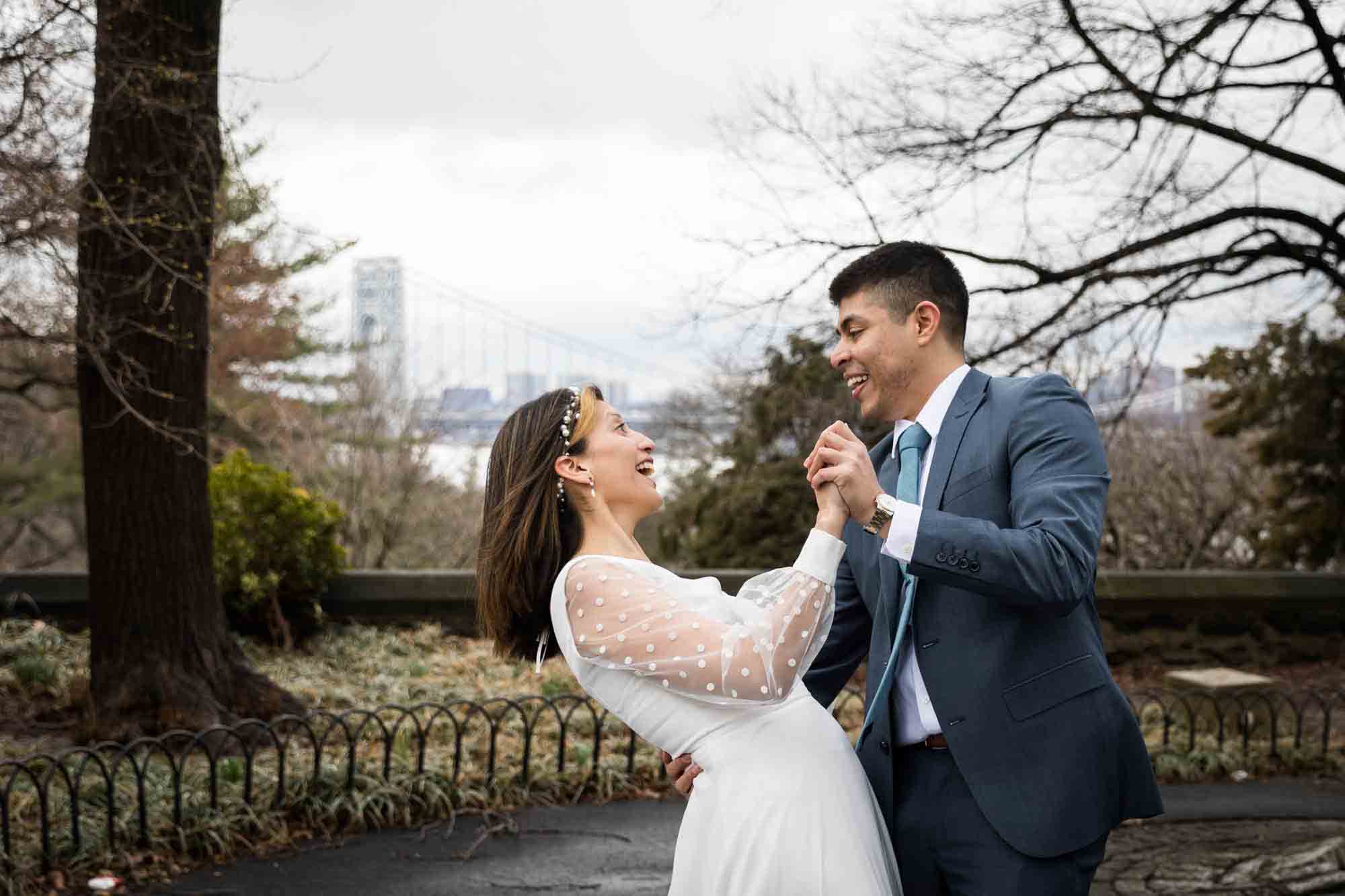 A bride and groom dancing on Linden Terrace during a Fort Tryon Park wedding